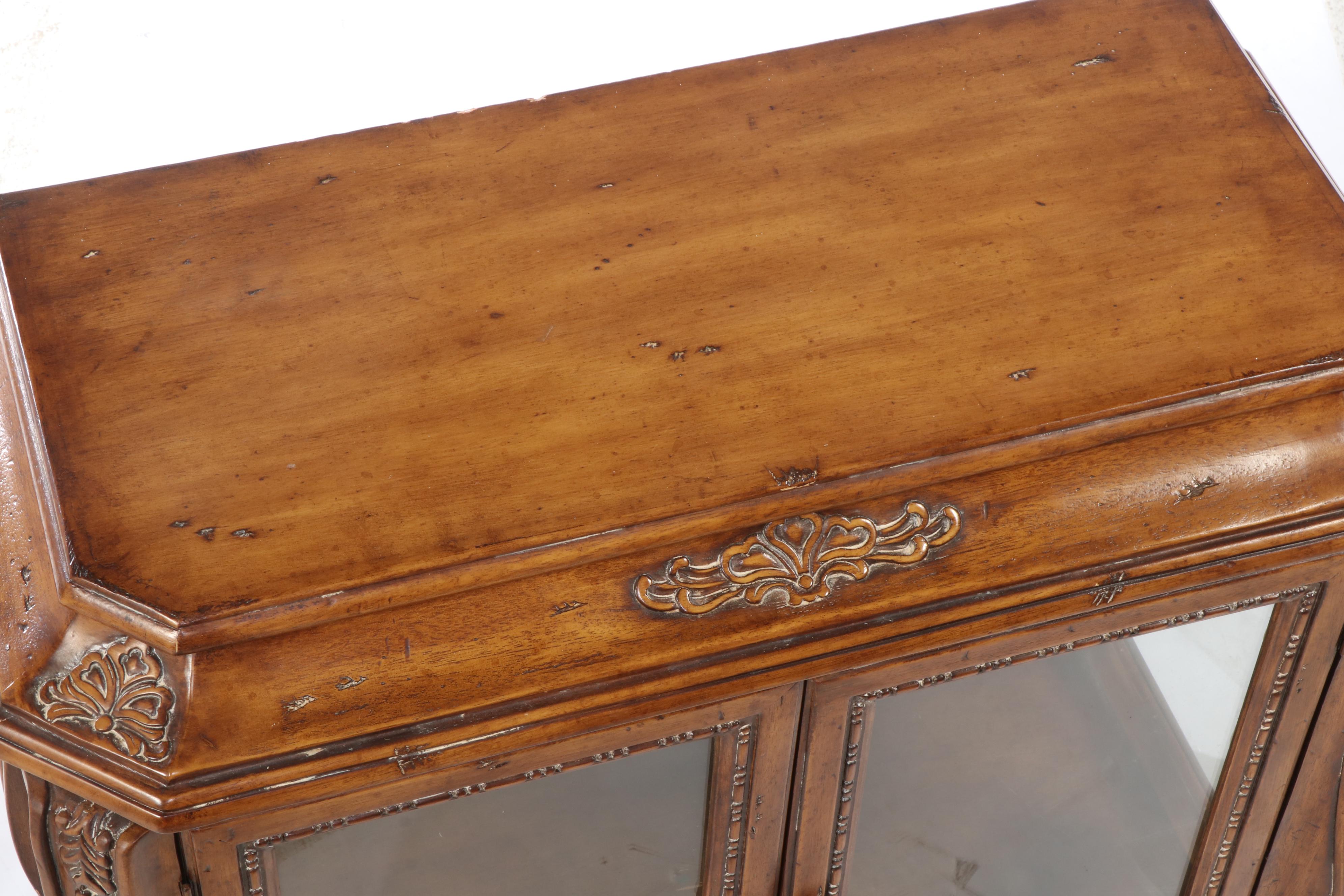 Butler Specialty Co. Hardwood and Glass Bombe-Form Curio Cabinet