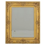 Beveled Mirror Featuring Ornate Gold Frame