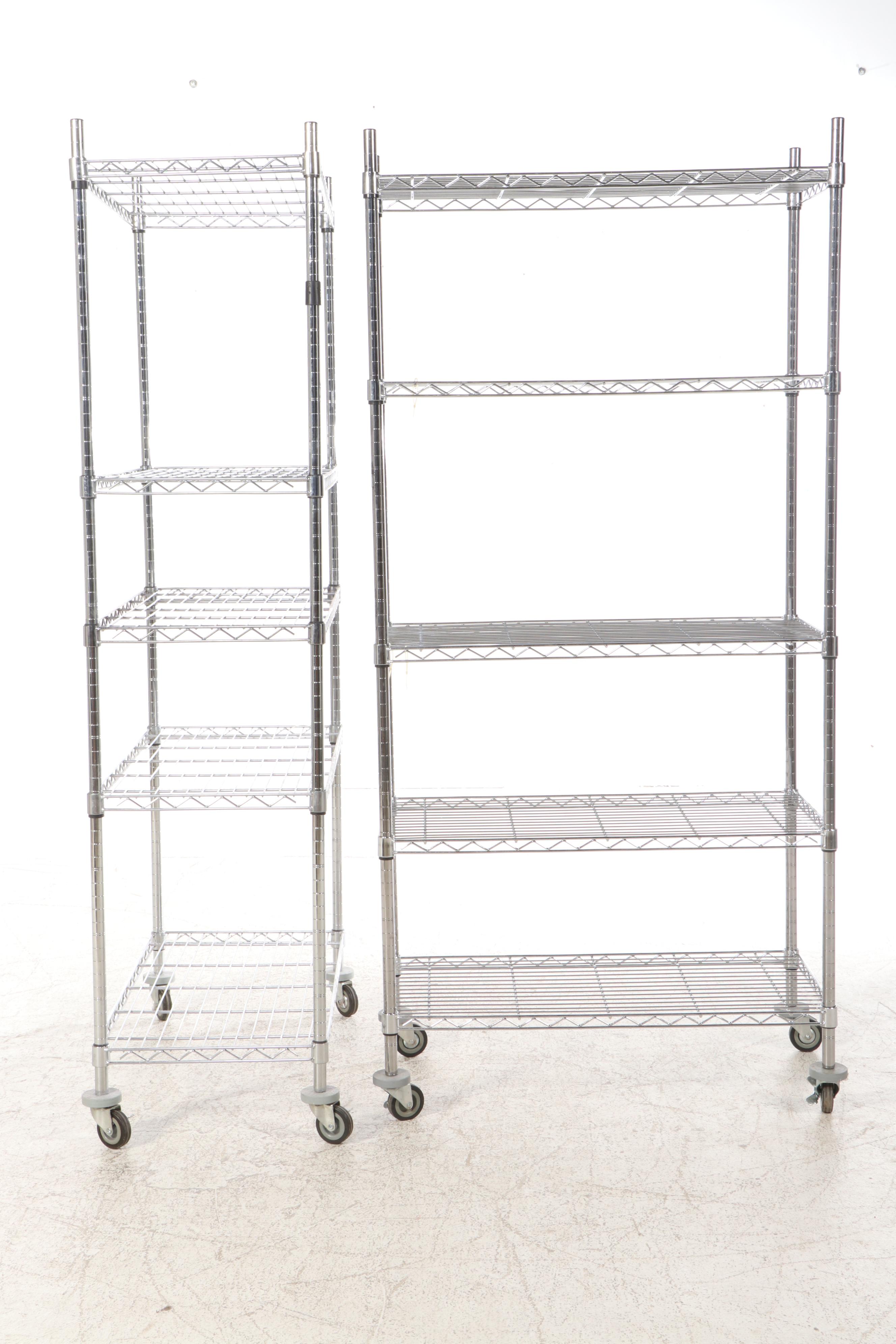 Three Chromed Metal Shelves on Wheels
