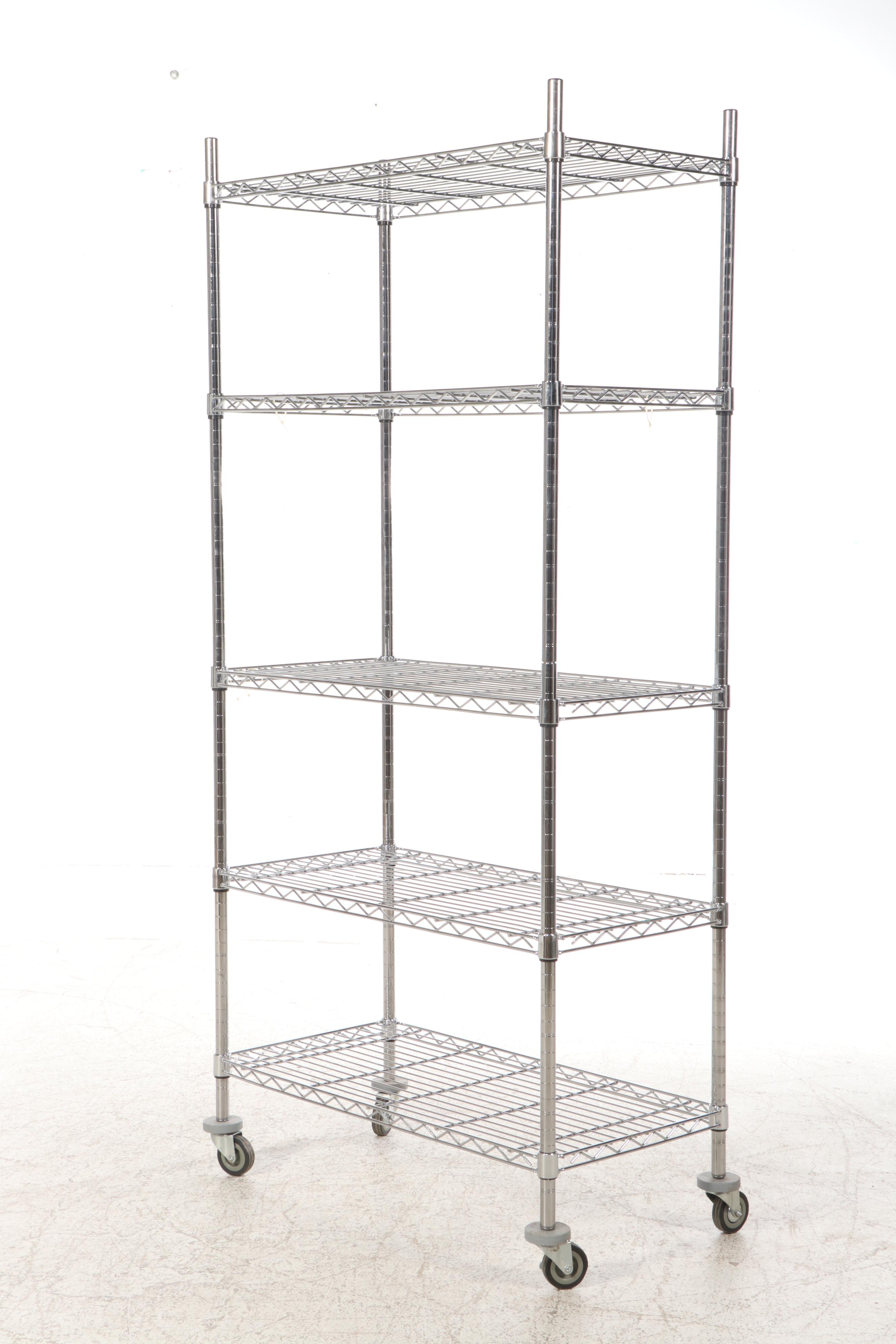 Three Chromed Metal Shelves on Wheels