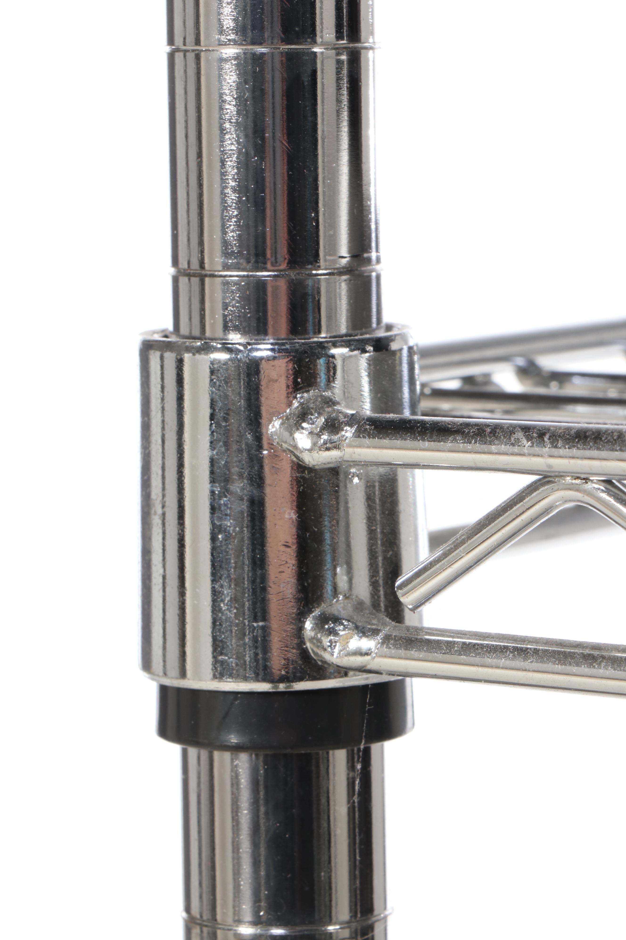 Three Chromed Metal Shelves on Wheels