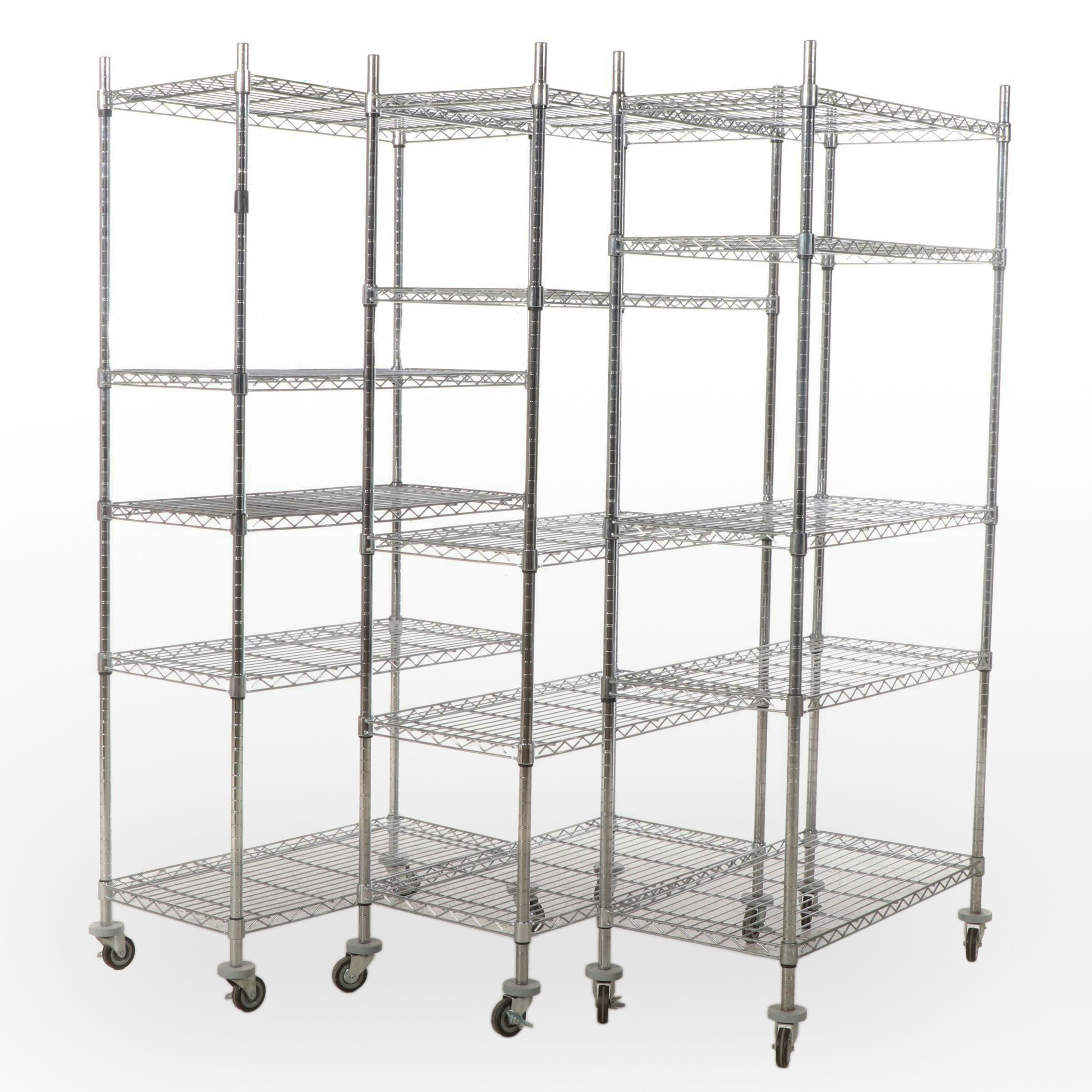 Three Chromed Metal Shelves on Wheels