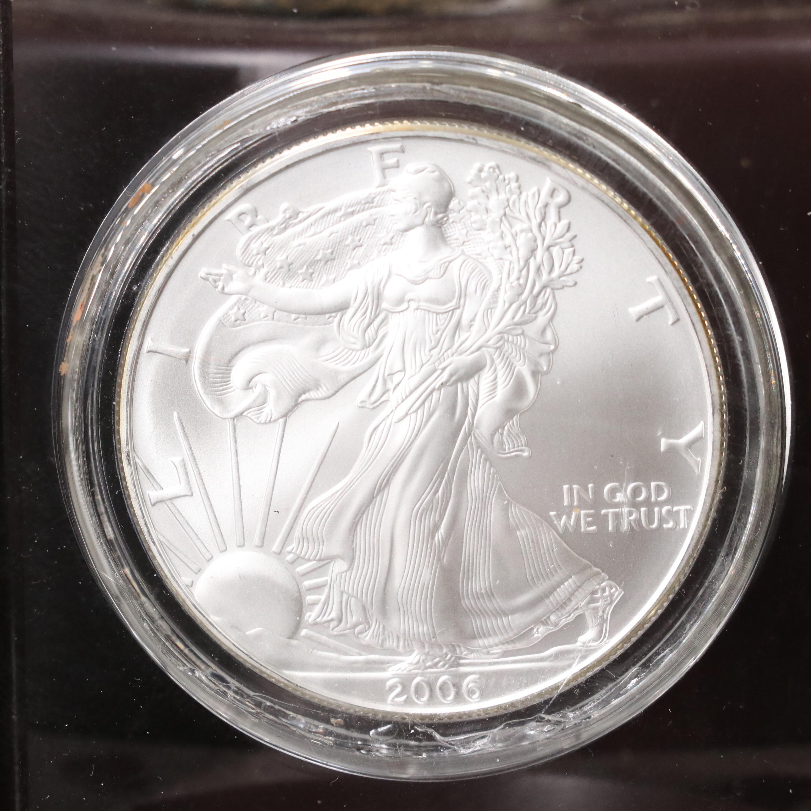 Resin Sculpture of a Bald Eagle With a Collection of American Silver Eagles