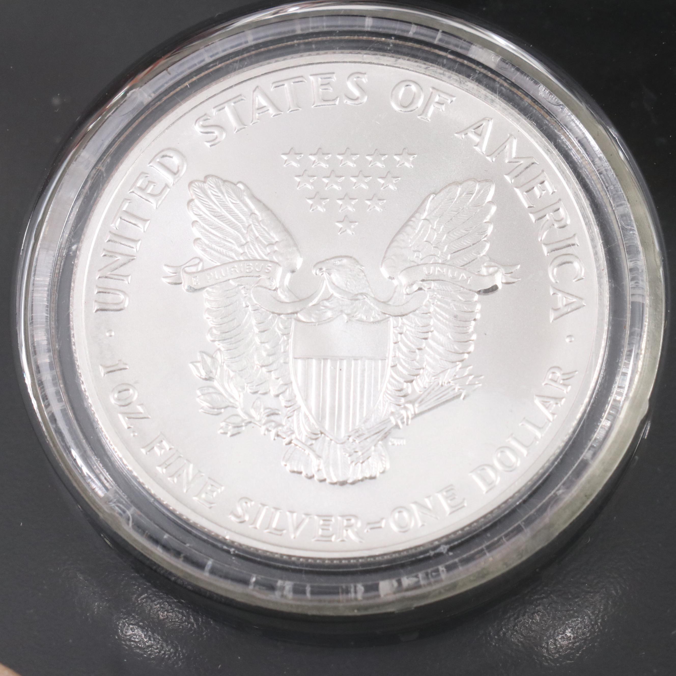 Resin Sculpture of a Bald Eagle With a Collection of American Silver Eagles