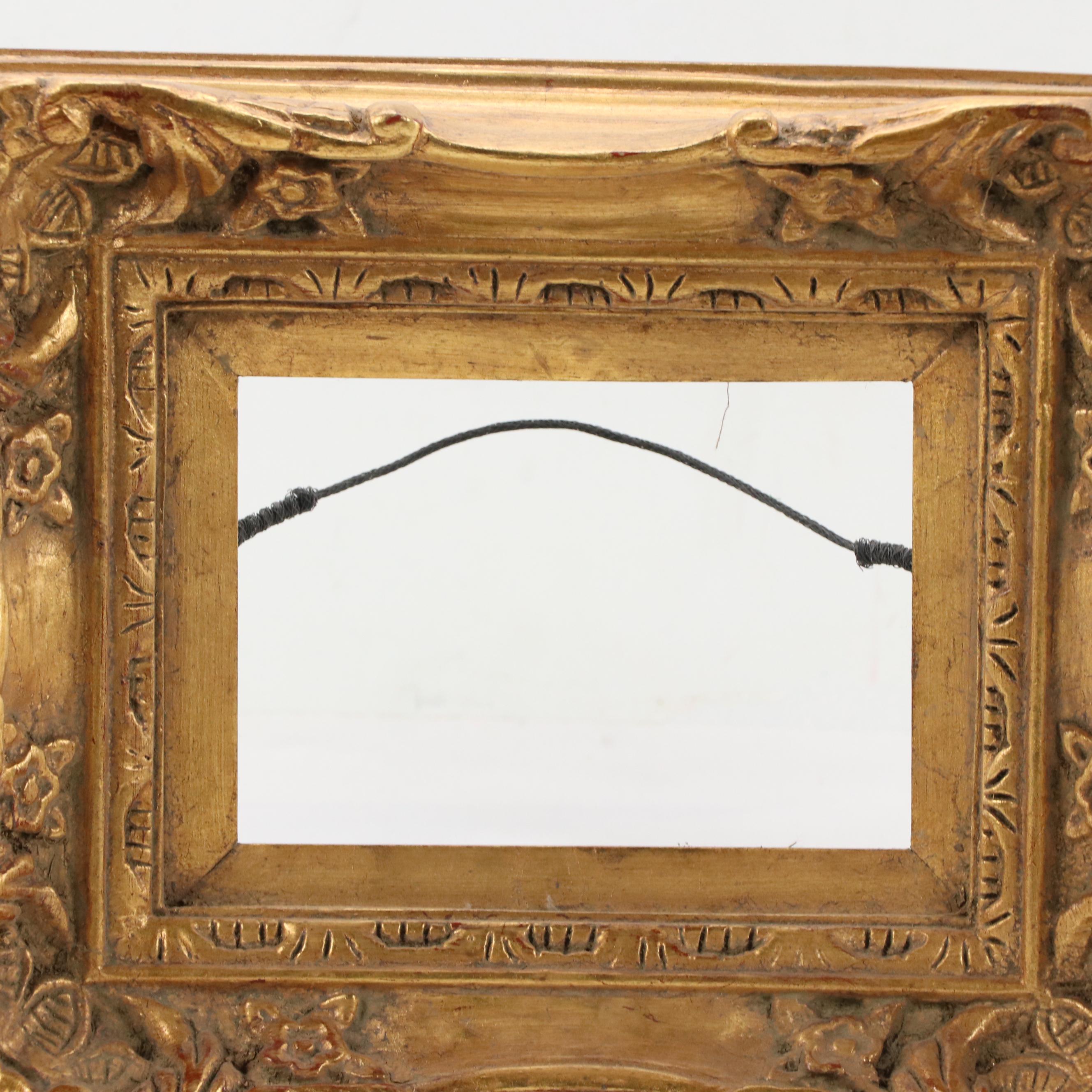 Carved Wood Frame With Scrolled Corners and Gilt Finish