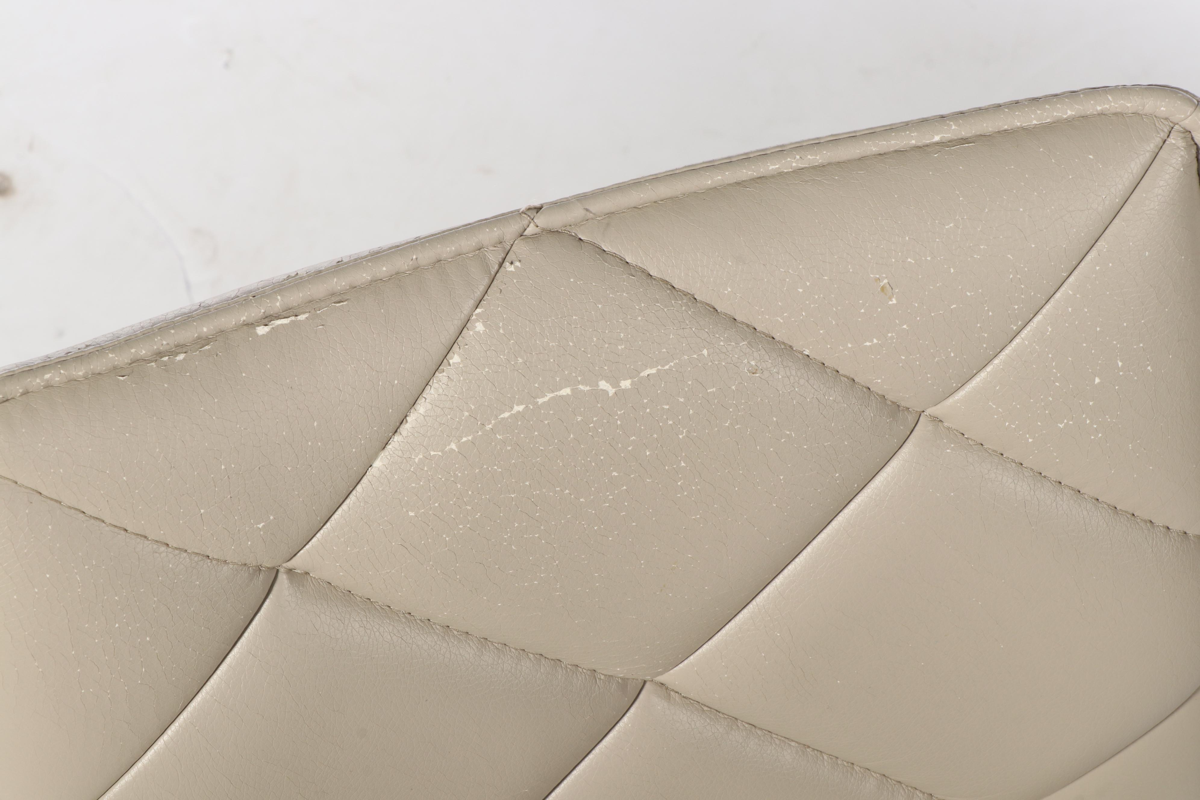 Four Modernist Style Chrome and Faux-Leather Sled-Base Dining Side Chairs