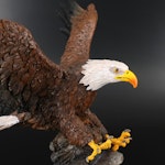 Resin Sculpture of a Bald Eagle With "War memorial" Colorized Silver Eagles