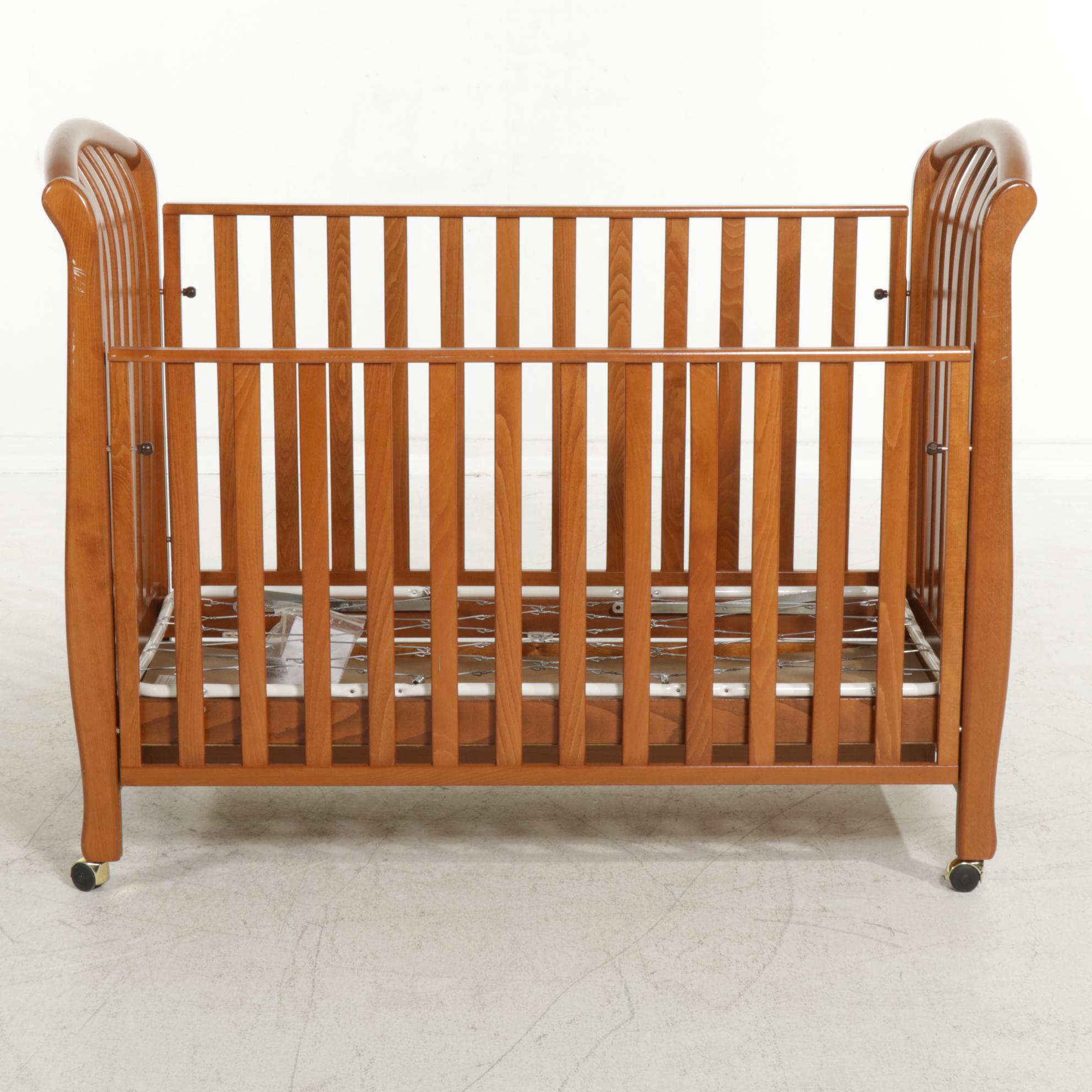 Bellini Wooden Crib with Bottom Drawer, Drop Sides, and Wheels EBTH