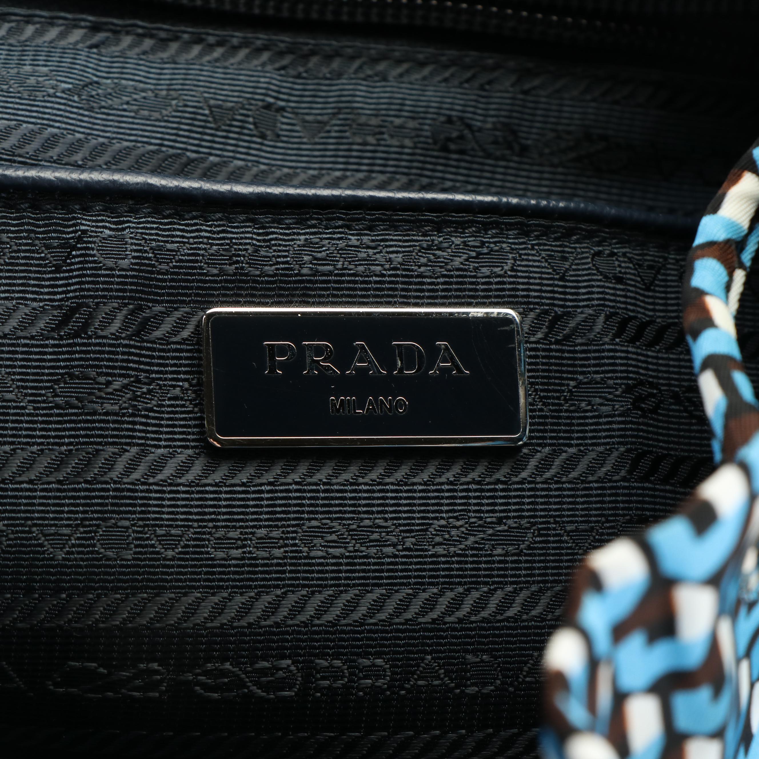 Prada  Geometric Print Tessuto Nylon Drawstring Front Zip Backpack