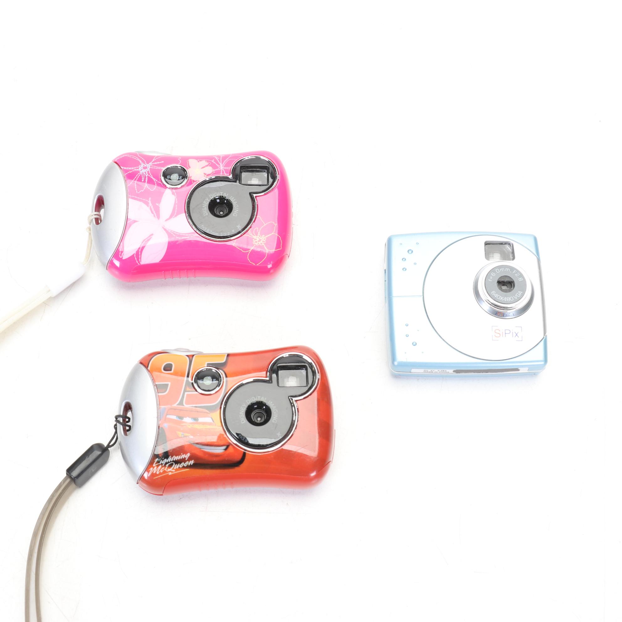 Canon EOS Rebel G Film Camera with Two Lenses and Digital Pocket Cameras