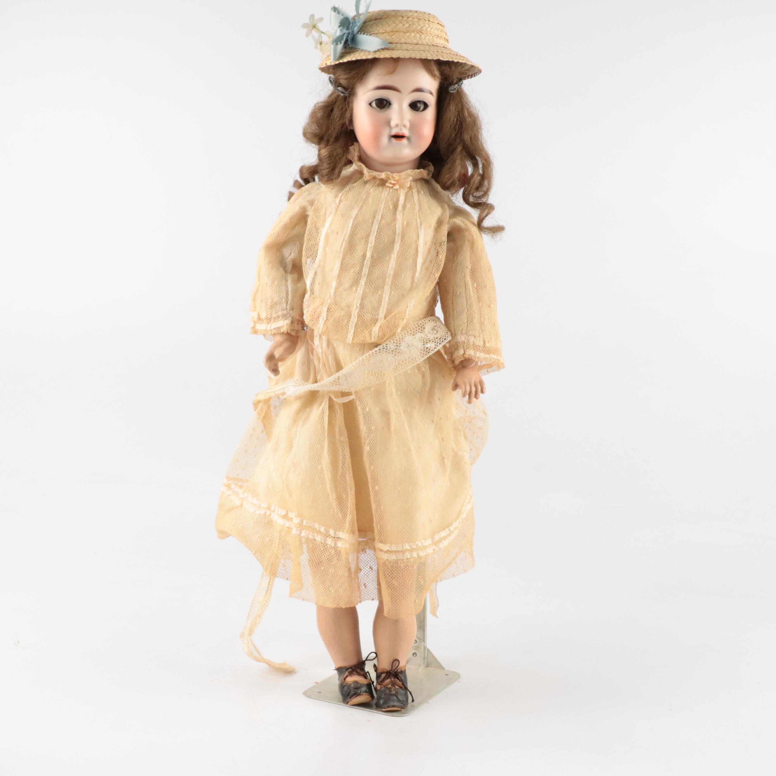 German Style Bisque Head and Composition Body Doll with Rocking Chair