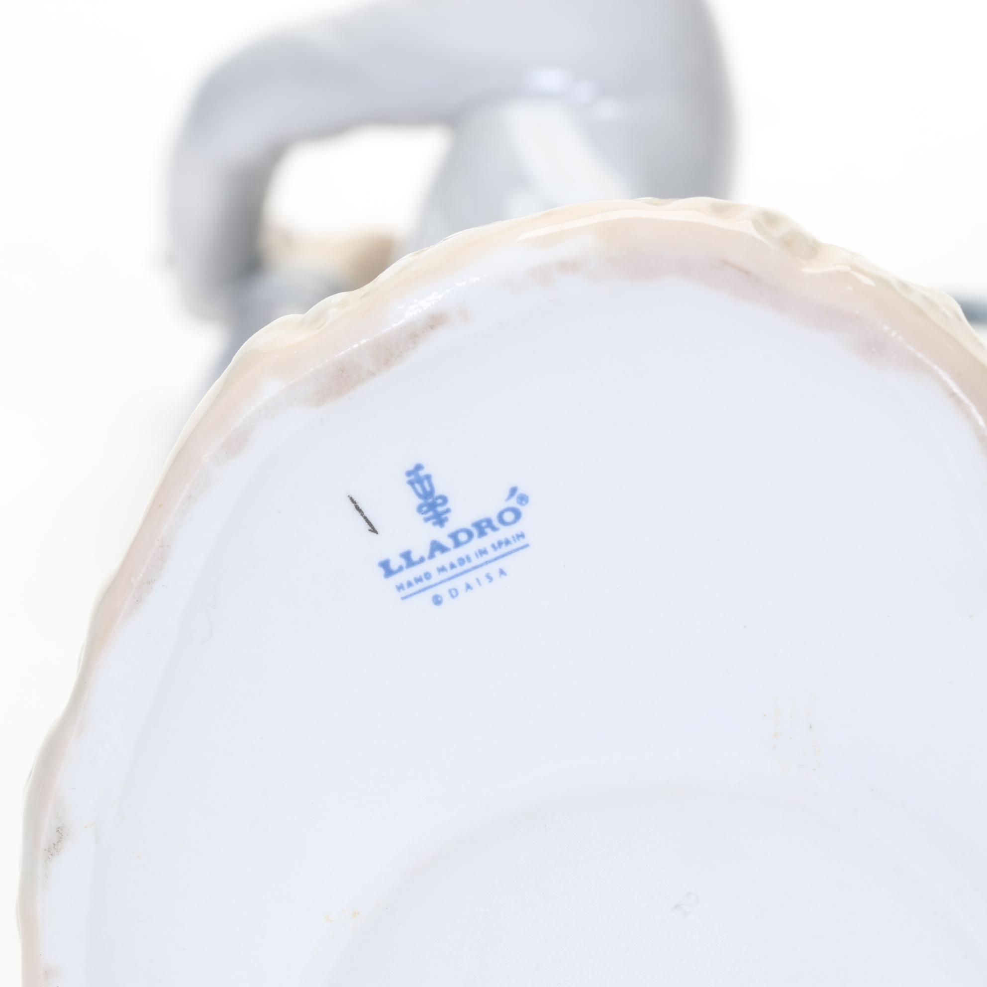 Lladró "Young Male Golfer" and "Waiting to Tee Off" Porcelain Figurines