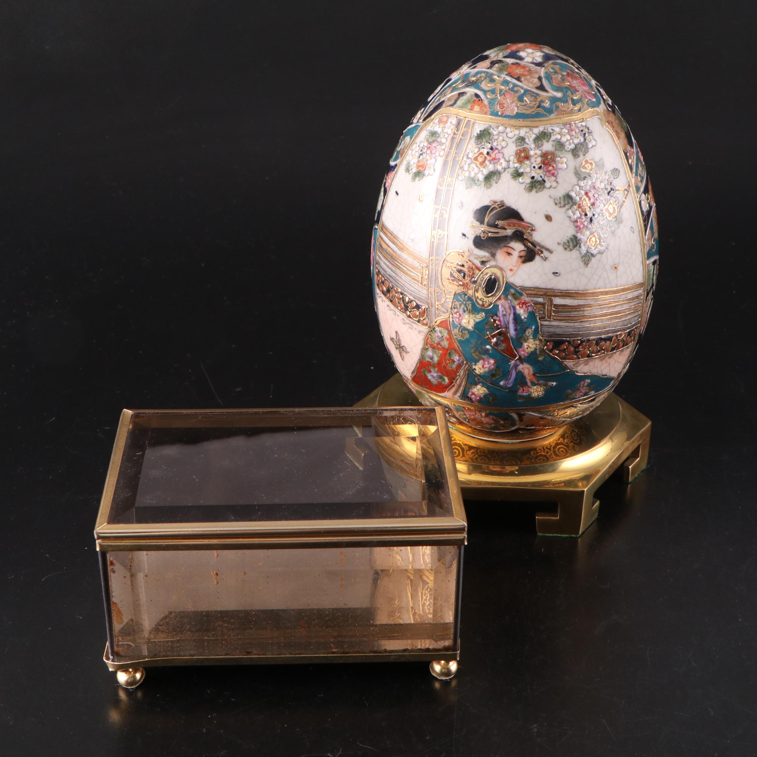 Japanese Satsuma Style Porcelain Egg with Brass Stand and Faceted Glass Box