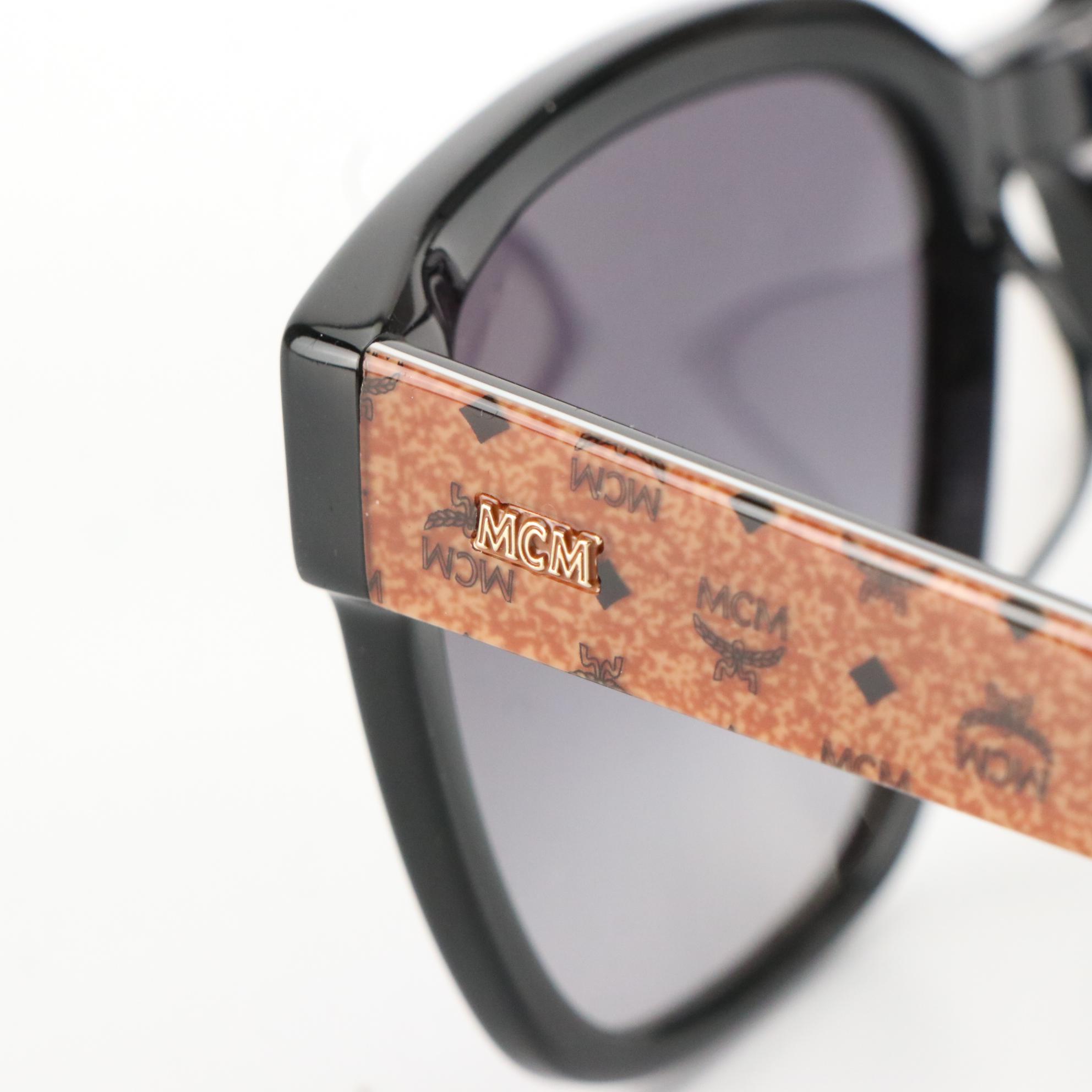 MCM 728SLB 005 Black Wayfarer Sunglasses with Tinted Jawns Case