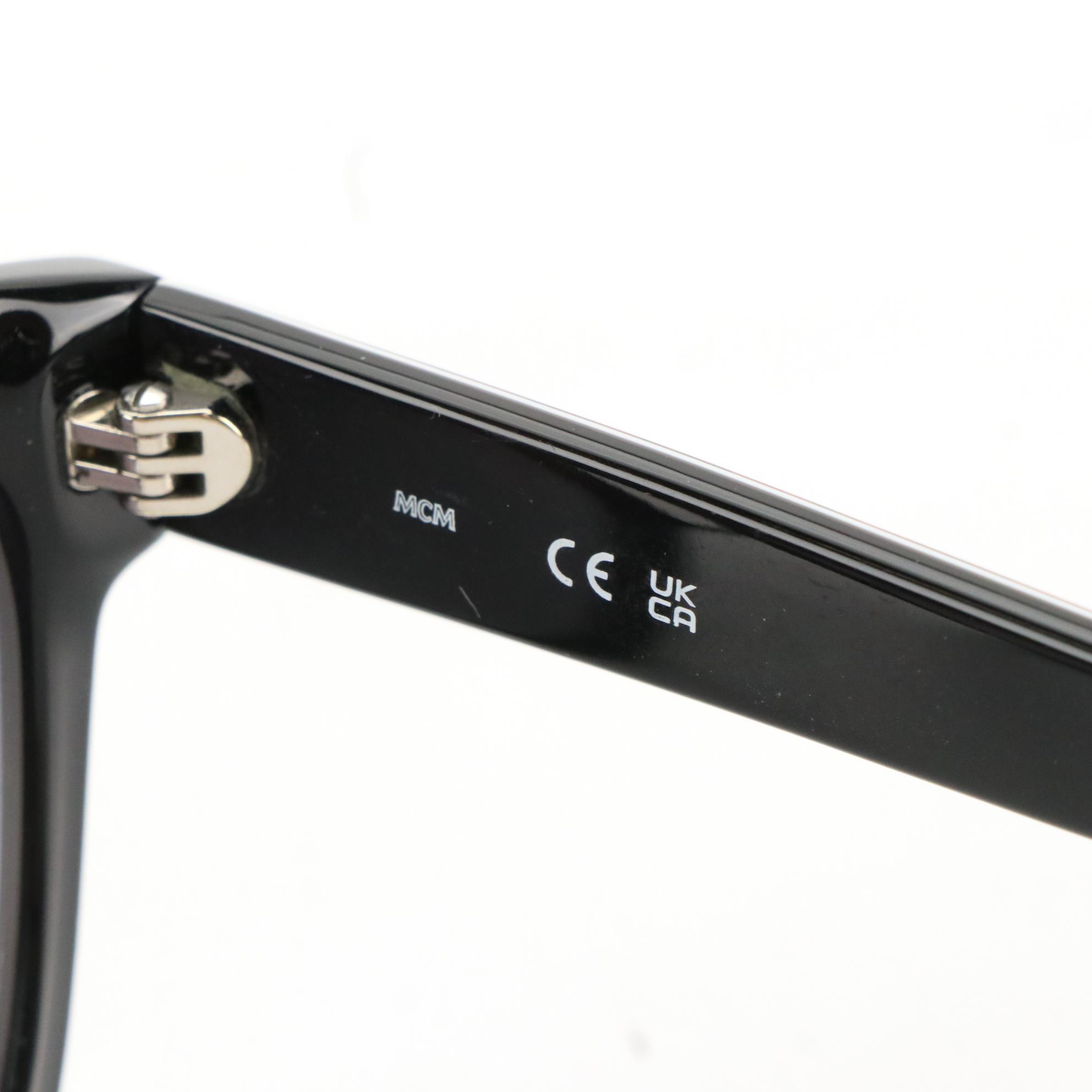 MCM 728SLB 005 Black Wayfarer Sunglasses with Tinted Jawns Case