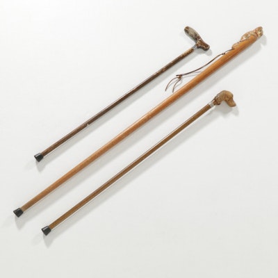 Wooden Walking Stick and Canes Featuring Carved Dog and Raccoon