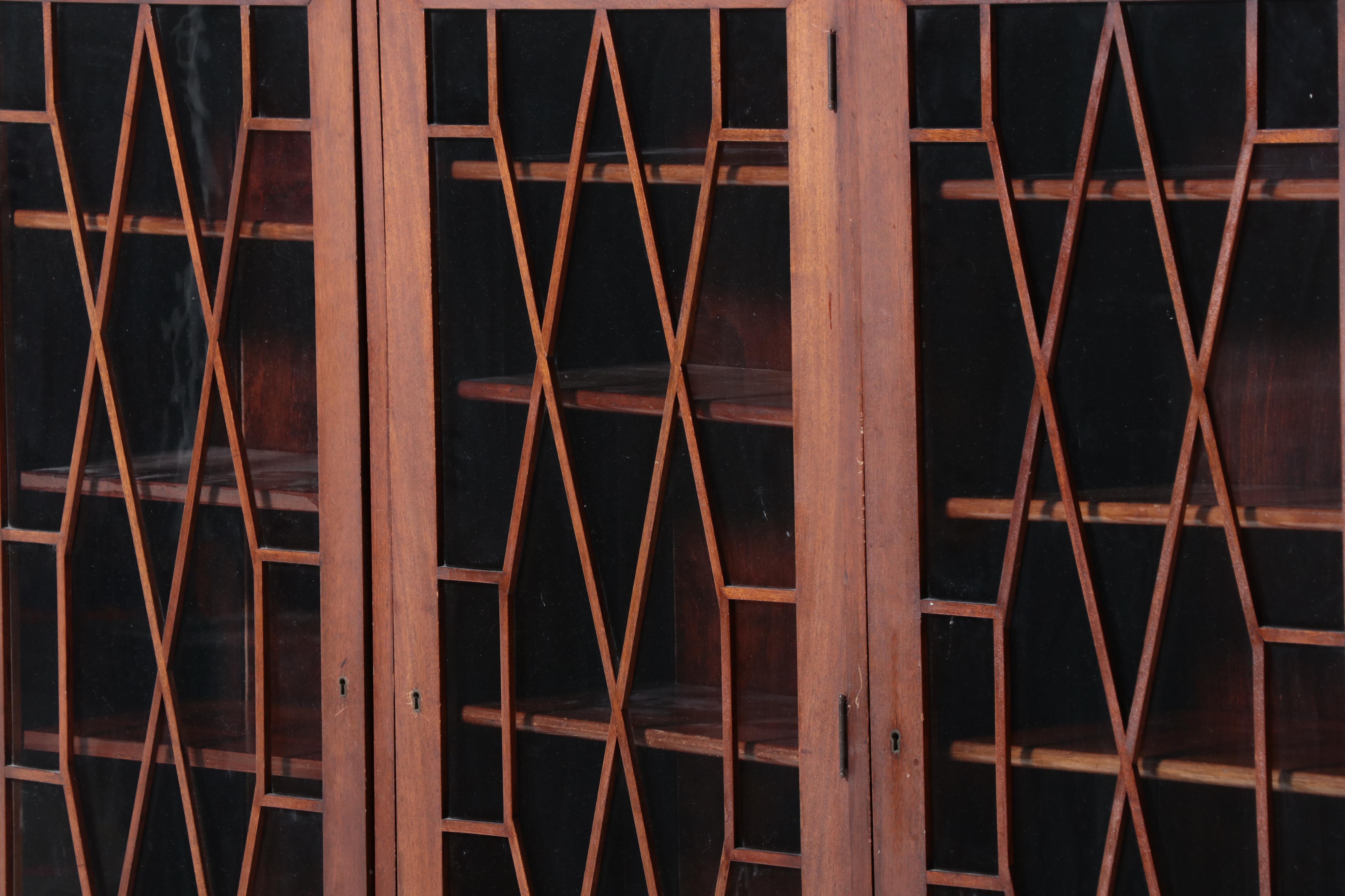 Chippendale Style Fretwork and Glass Front Bookcase on Casters, Early 20th C.
