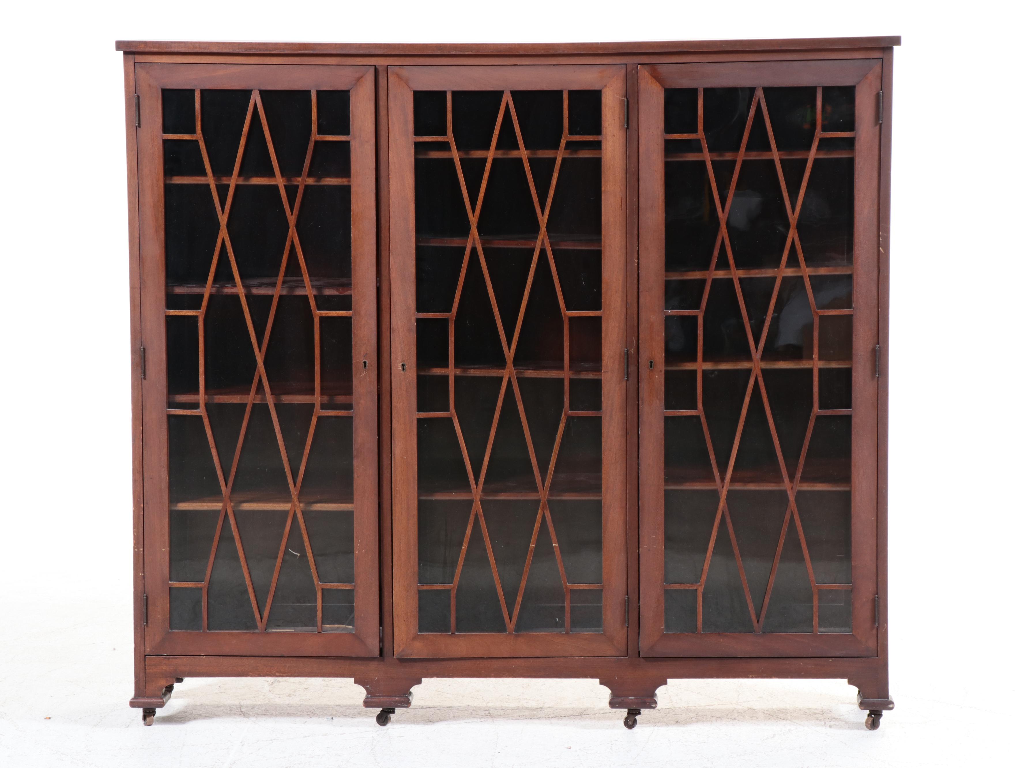 Chippendale Style Fretwork and Glass Front Bookcase on Casters, Early 20th C.