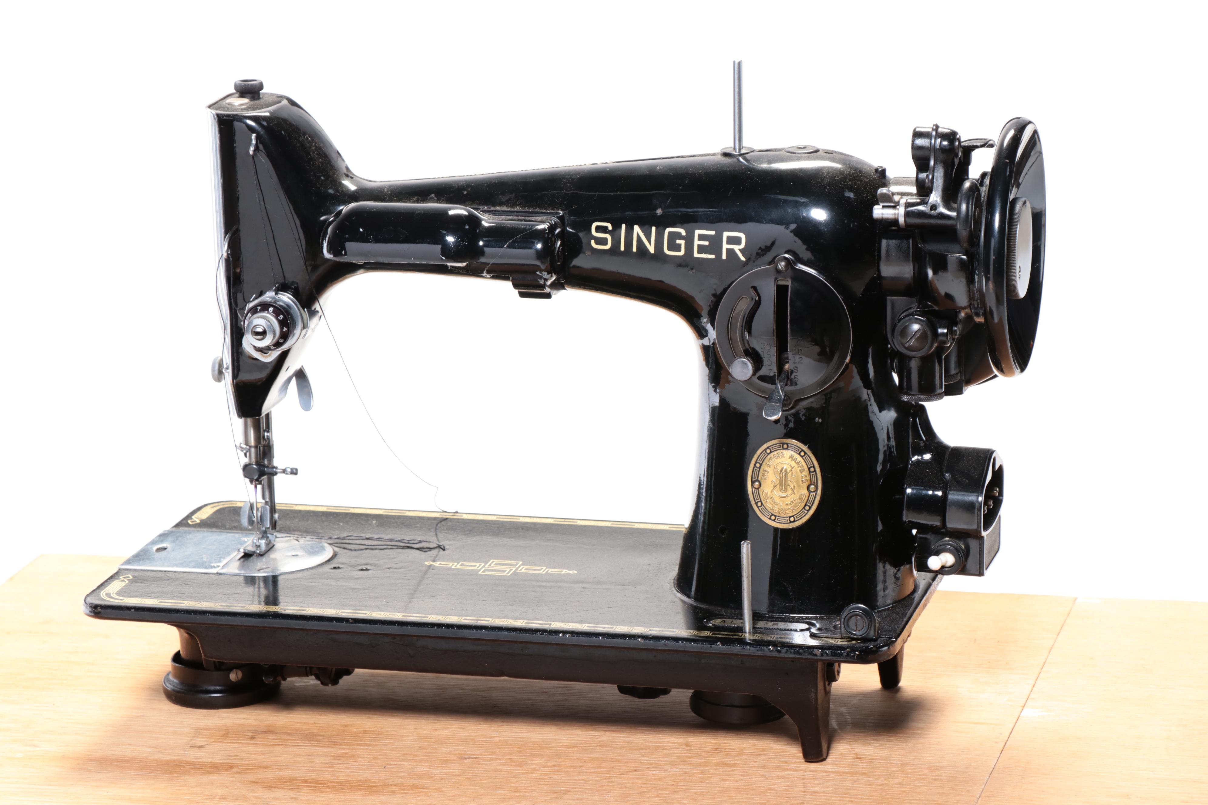 Singer Electric Sewing Machine on Sewing Cabinet with Seat and Notions, 1950s