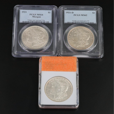 Three Morgan Silver Dollars Including a PCGS MS64 1921