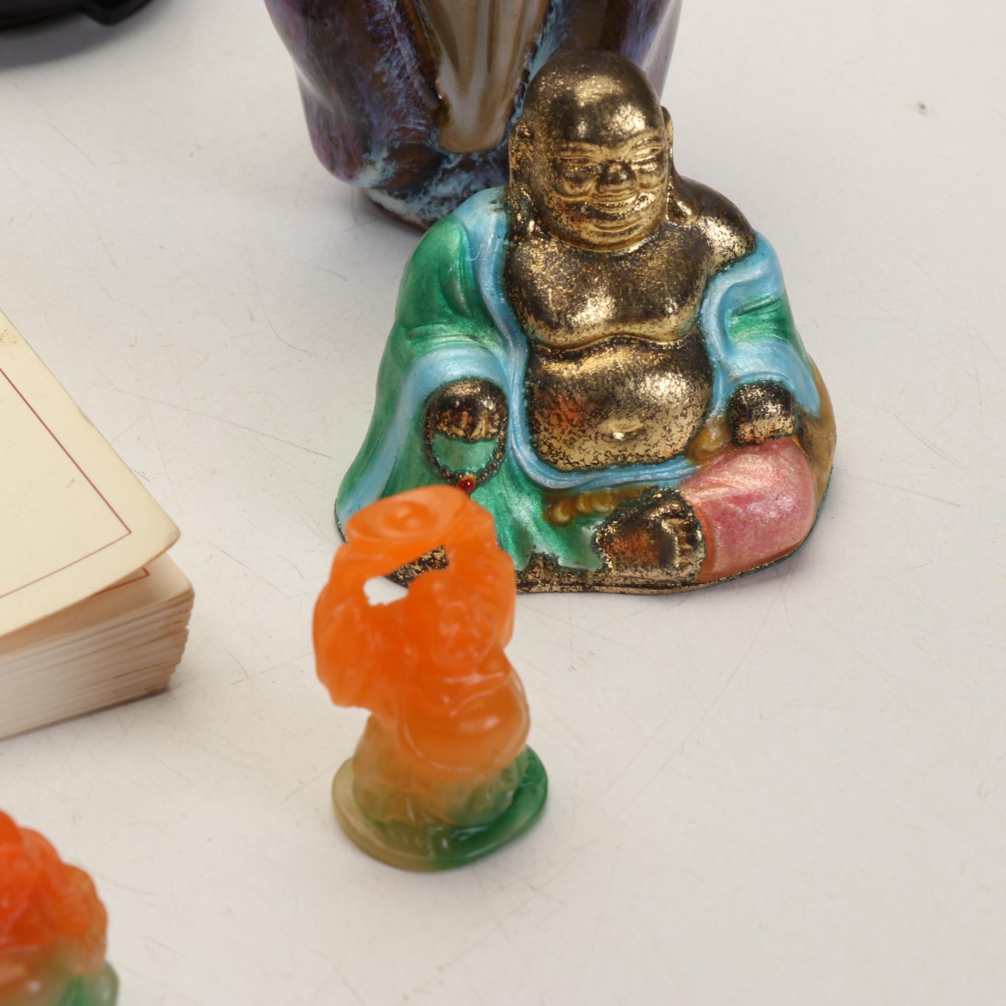 Buddha Collection Features Orange to Green Acrylic Laughing Buddhas and More