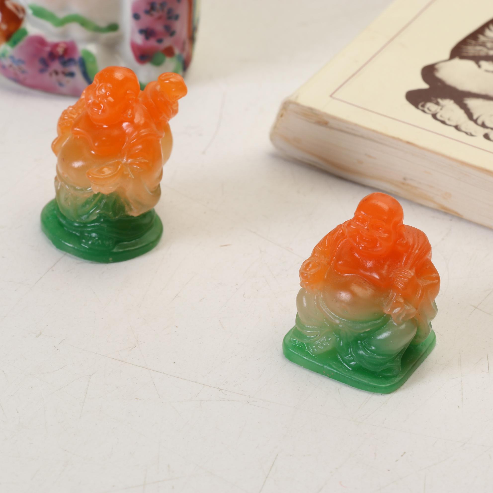 Buddha Collection Features Orange to Green Acrylic Laughing Buddhas and More