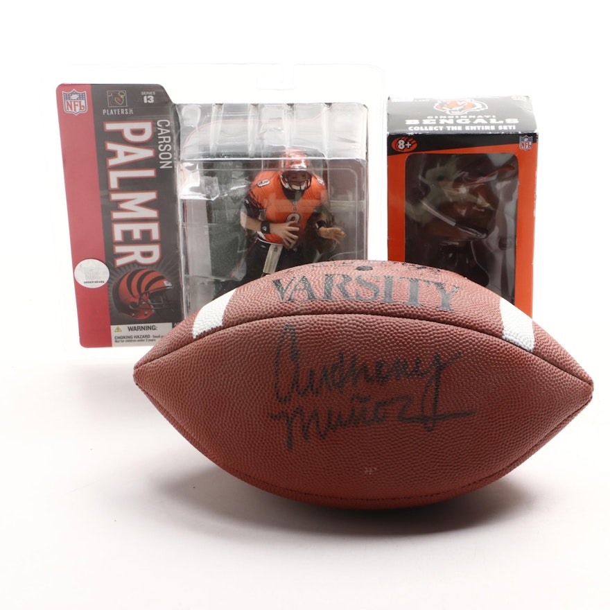 Anthony Muñoz Signed Football with Carson Palmer McFarlane Figure and More