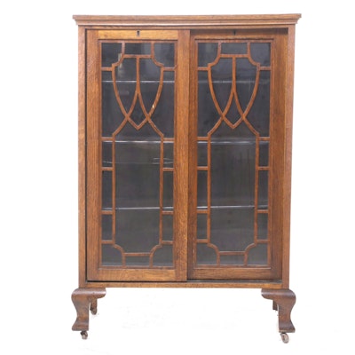 Colonial Revival Oak and Glass Sliding Door Bookcase