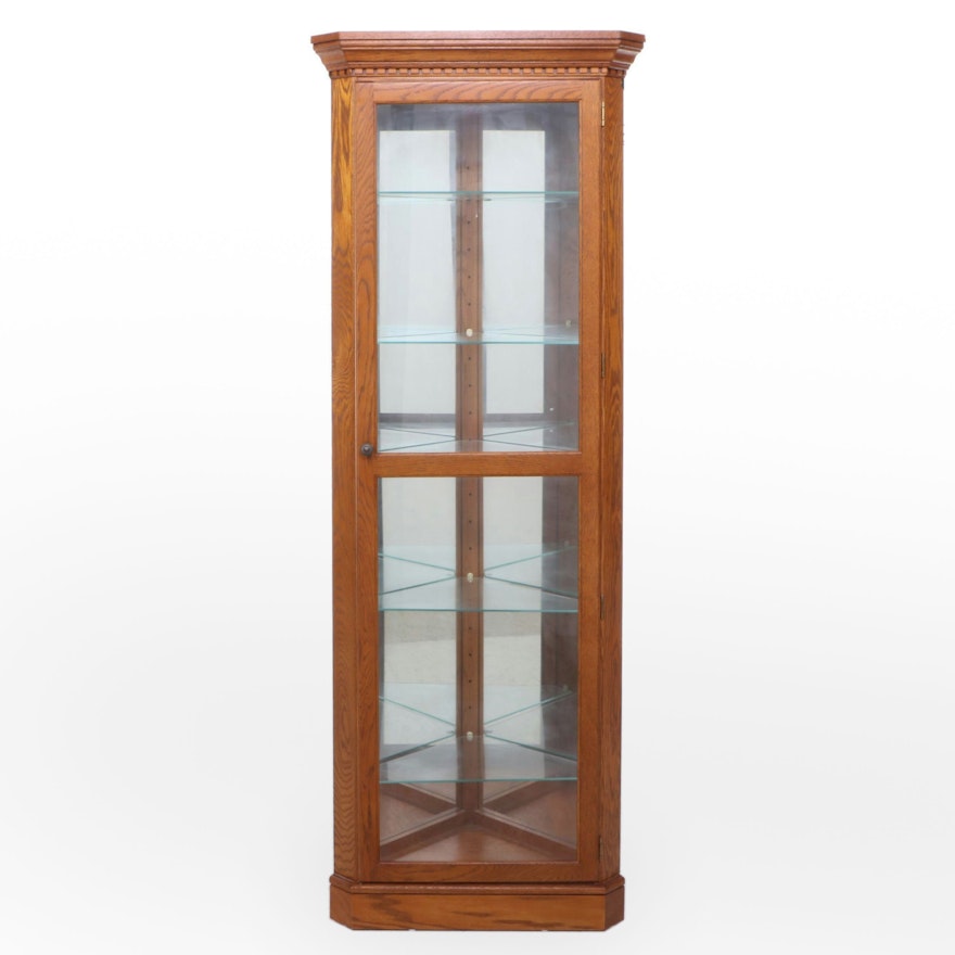 Colonial Style Oak Glass-Front Illuminated Corner Cabinet