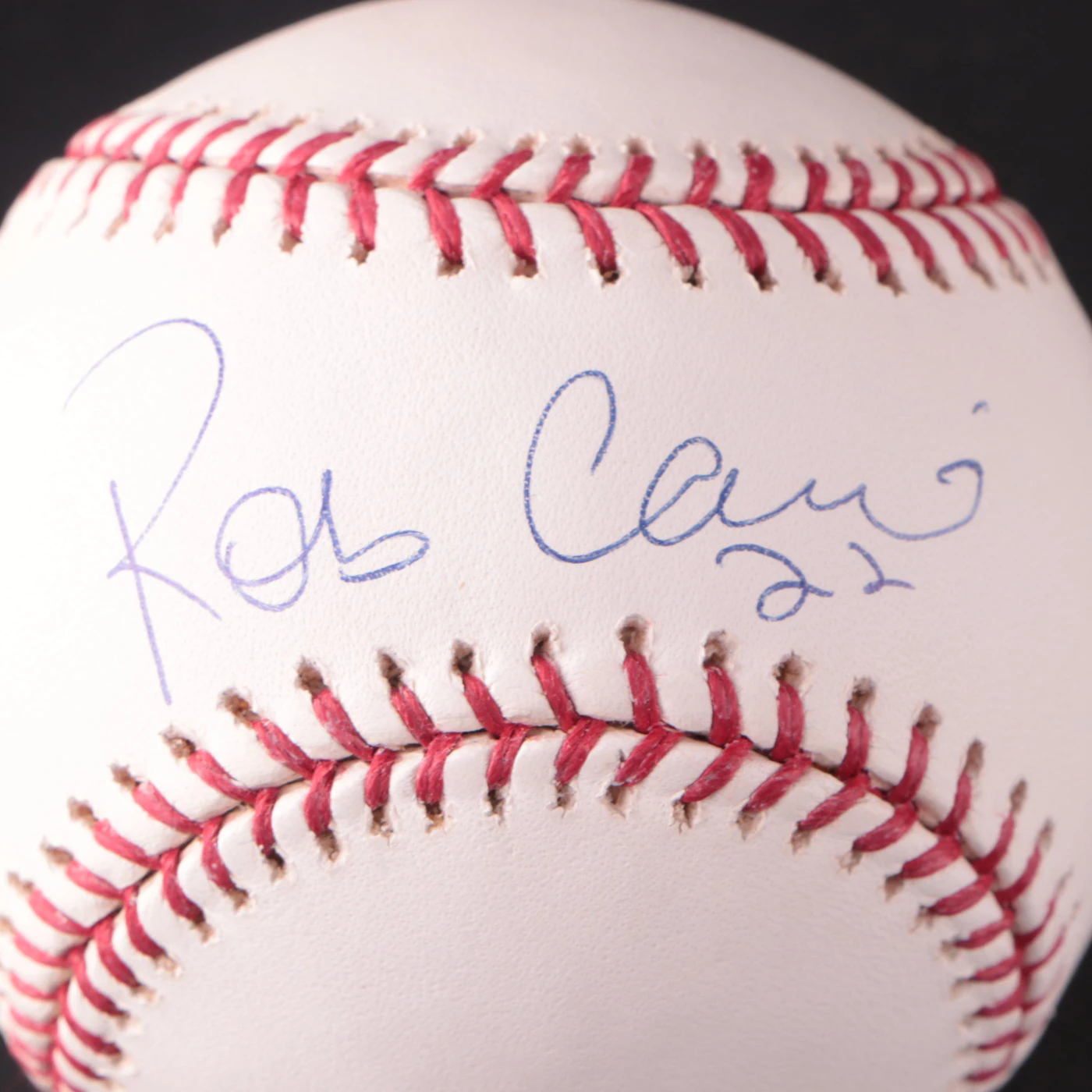 A pristine Rawlings baseball signed by Alex Rodriguez, Gary Sheffield, and Robinson Canó, showcasing the rich patina of a well-preserved collectible.
