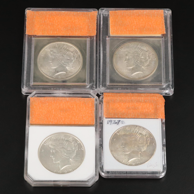Four Peace Silver Dollars Including a 1927-S