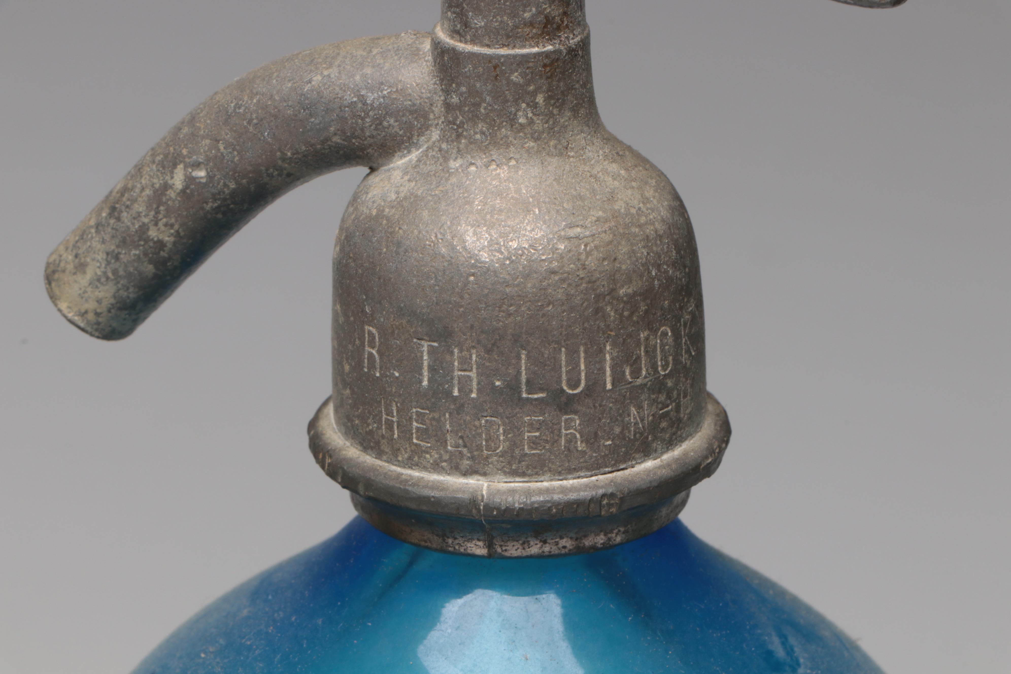 Art Deco Style Seltzer with Other Bottles and Stoppers