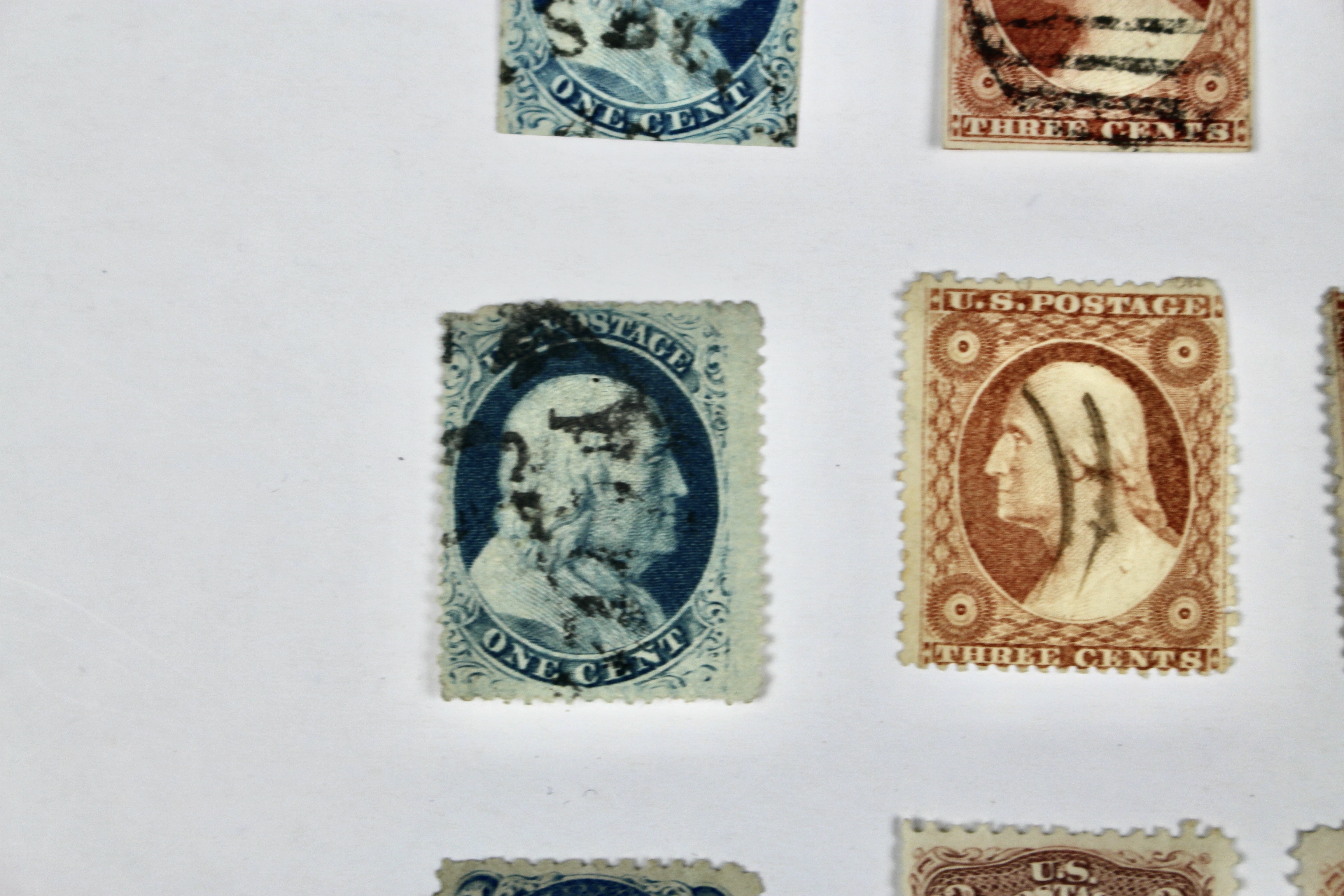 Twenty-Five Early U.S. Postage Stamps, Many with Grills