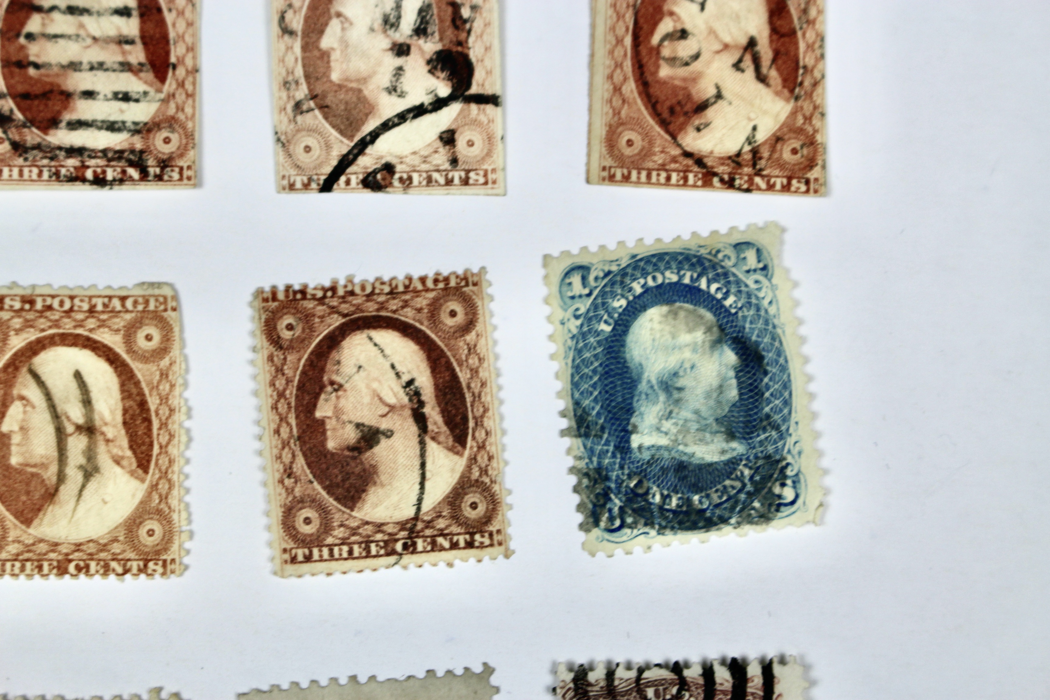 Twenty-Five Early U.S. Postage Stamps, Many with Grills
