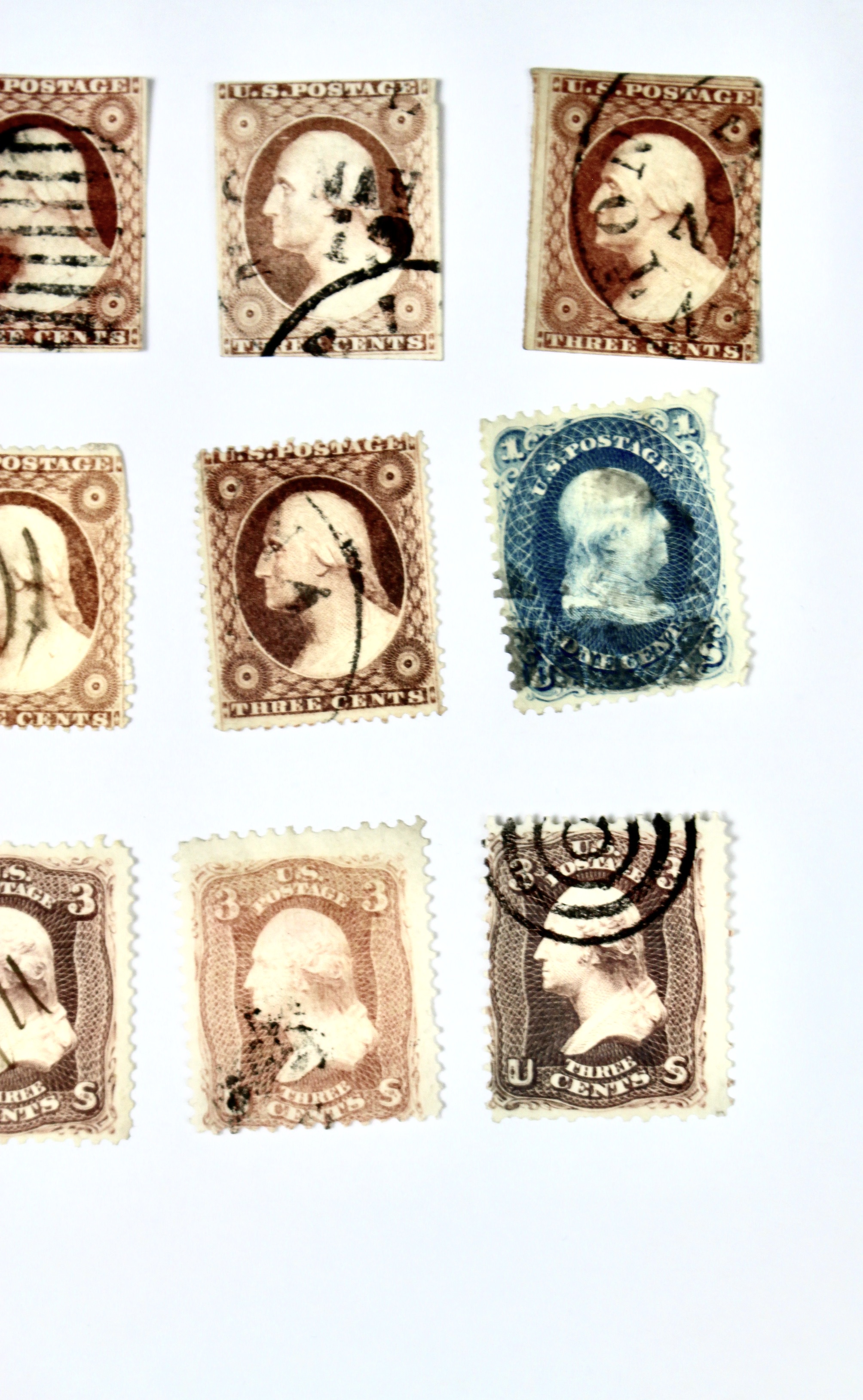 Twenty-Five Early U.S. Postage Stamps, Many with Grills