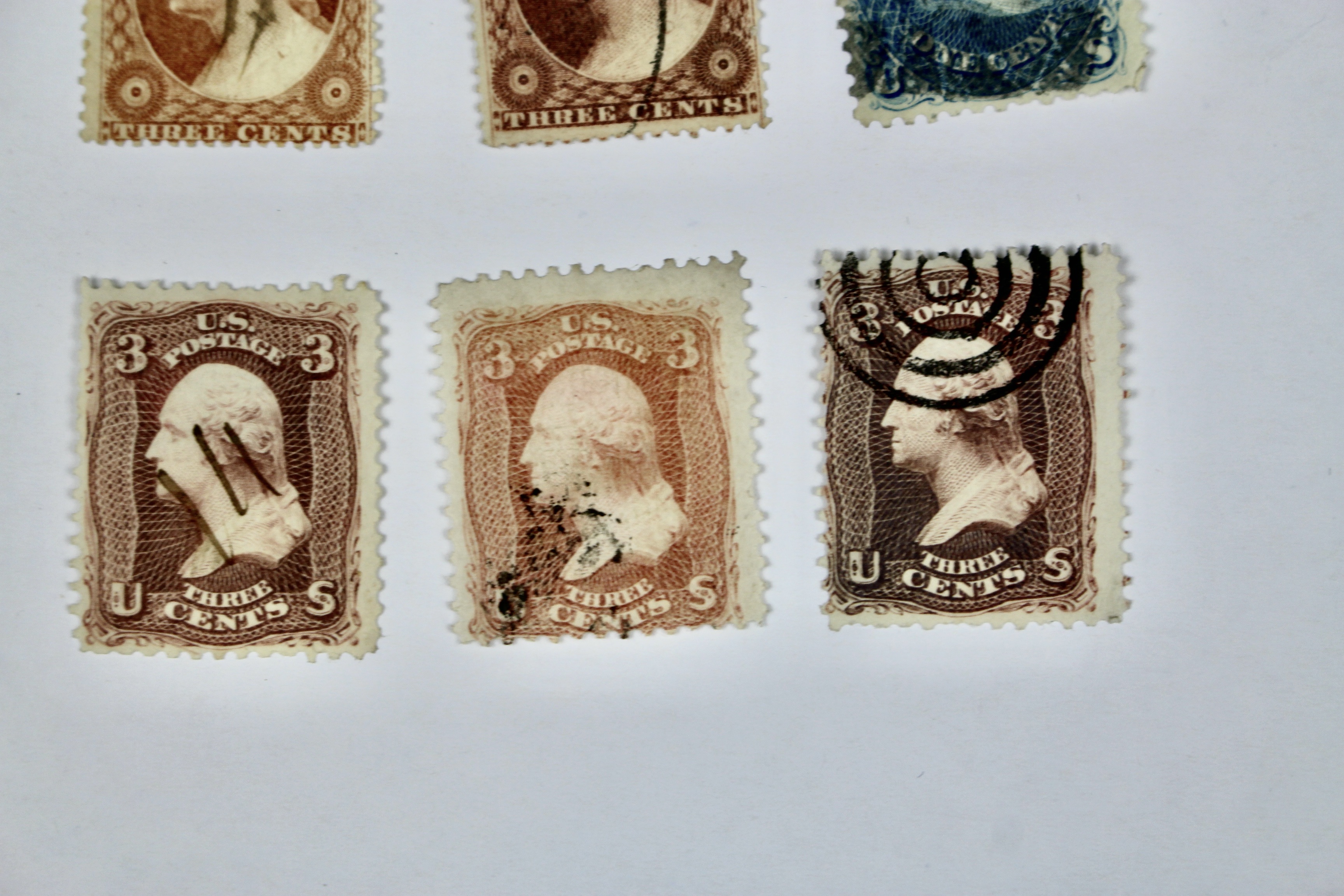 Twenty-Five Early U.S. Postage Stamps, Many with Grills