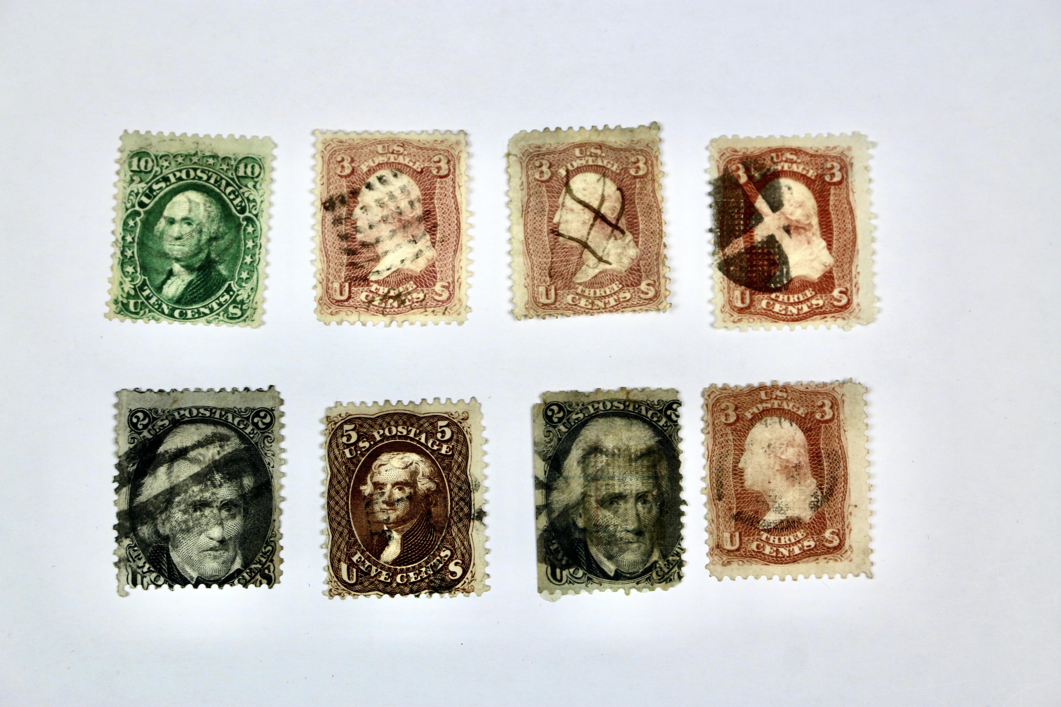 Twenty-Five Early U.S. Postage Stamps, Many with Grills