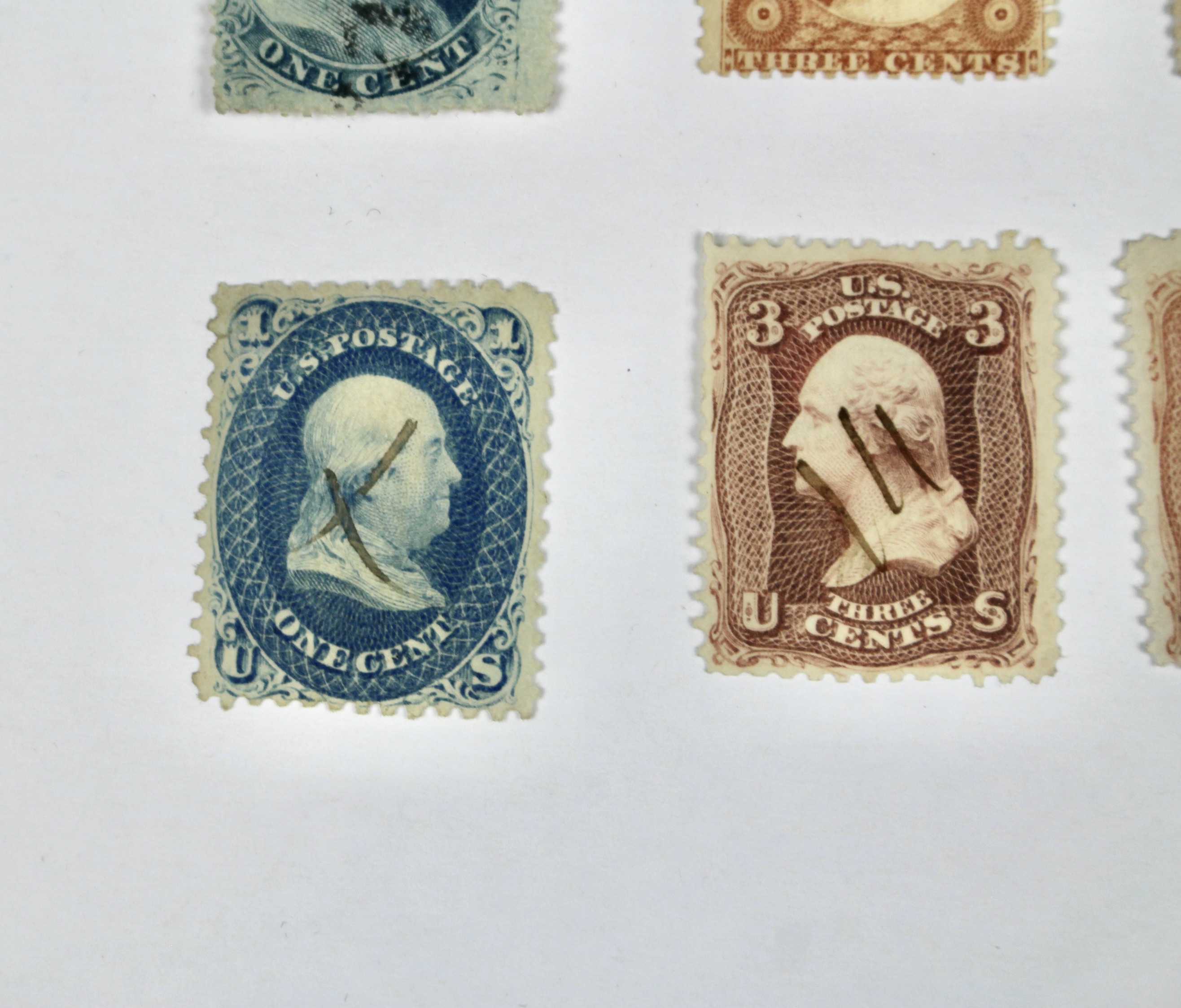 Twenty-Five Early U.S. Postage Stamps, Many with Grills