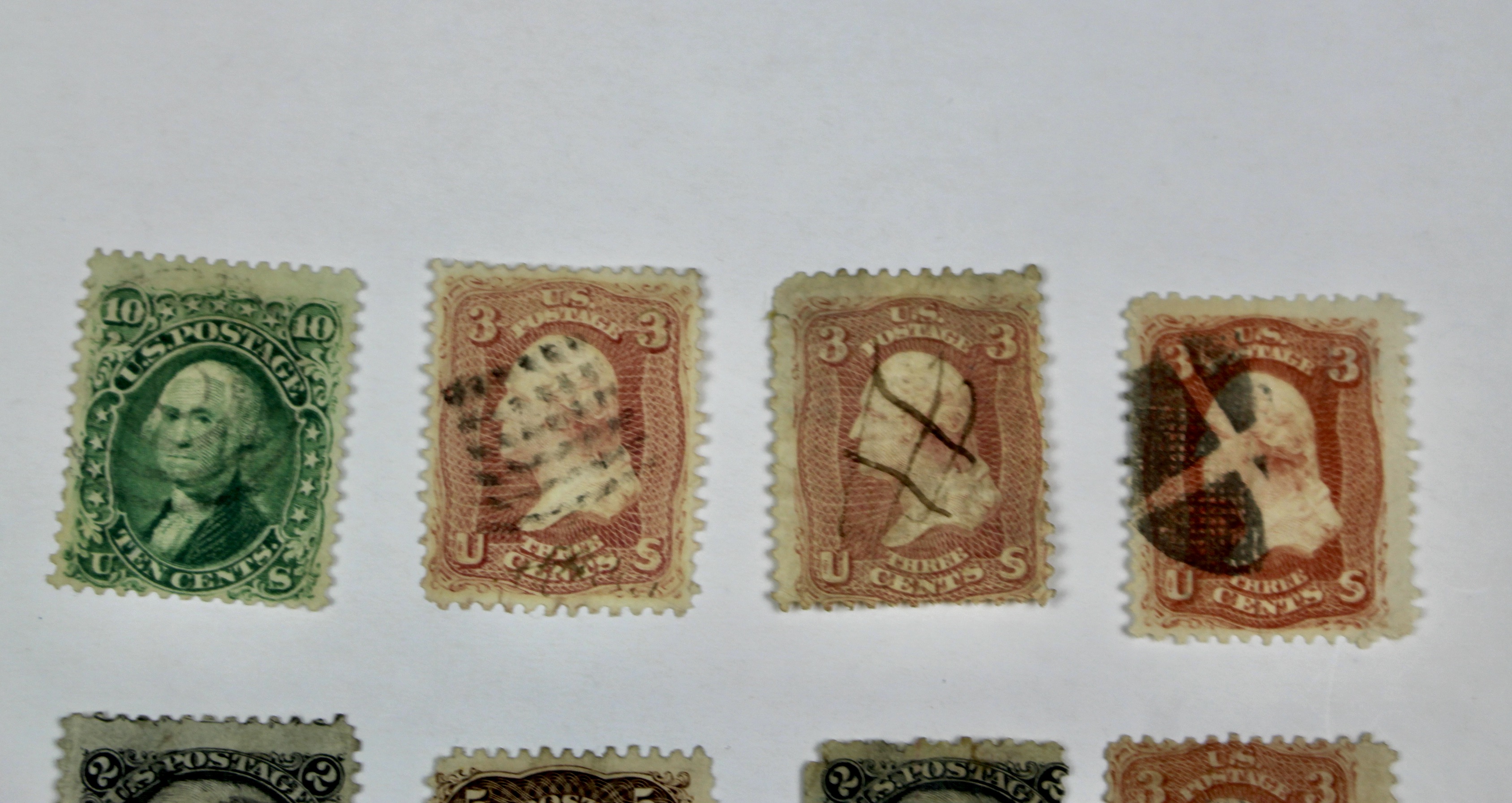 Twenty-Five Early U.S. Postage Stamps, Many with Grills