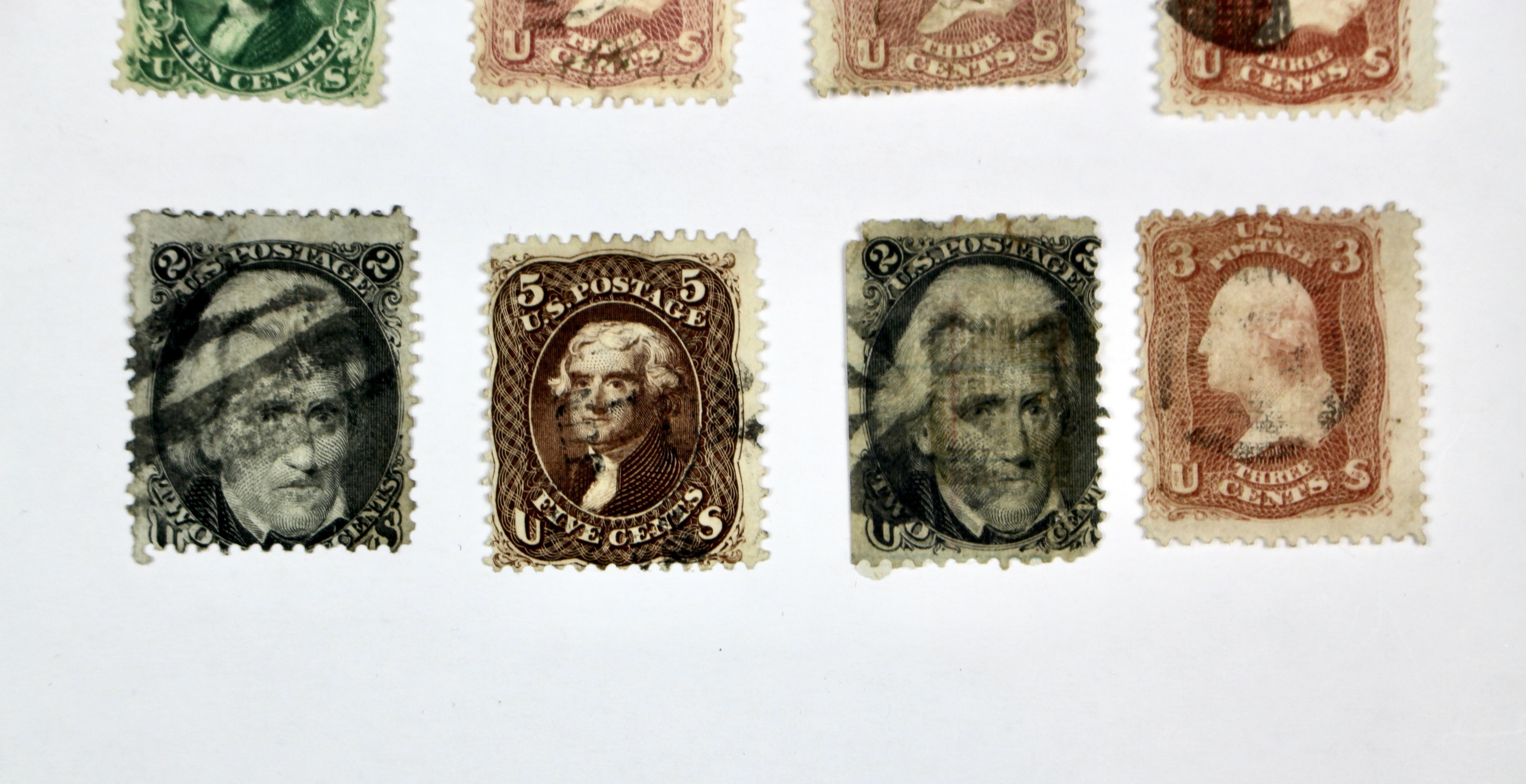 Twenty-Five Early U.S. Postage Stamps, Many with Grills