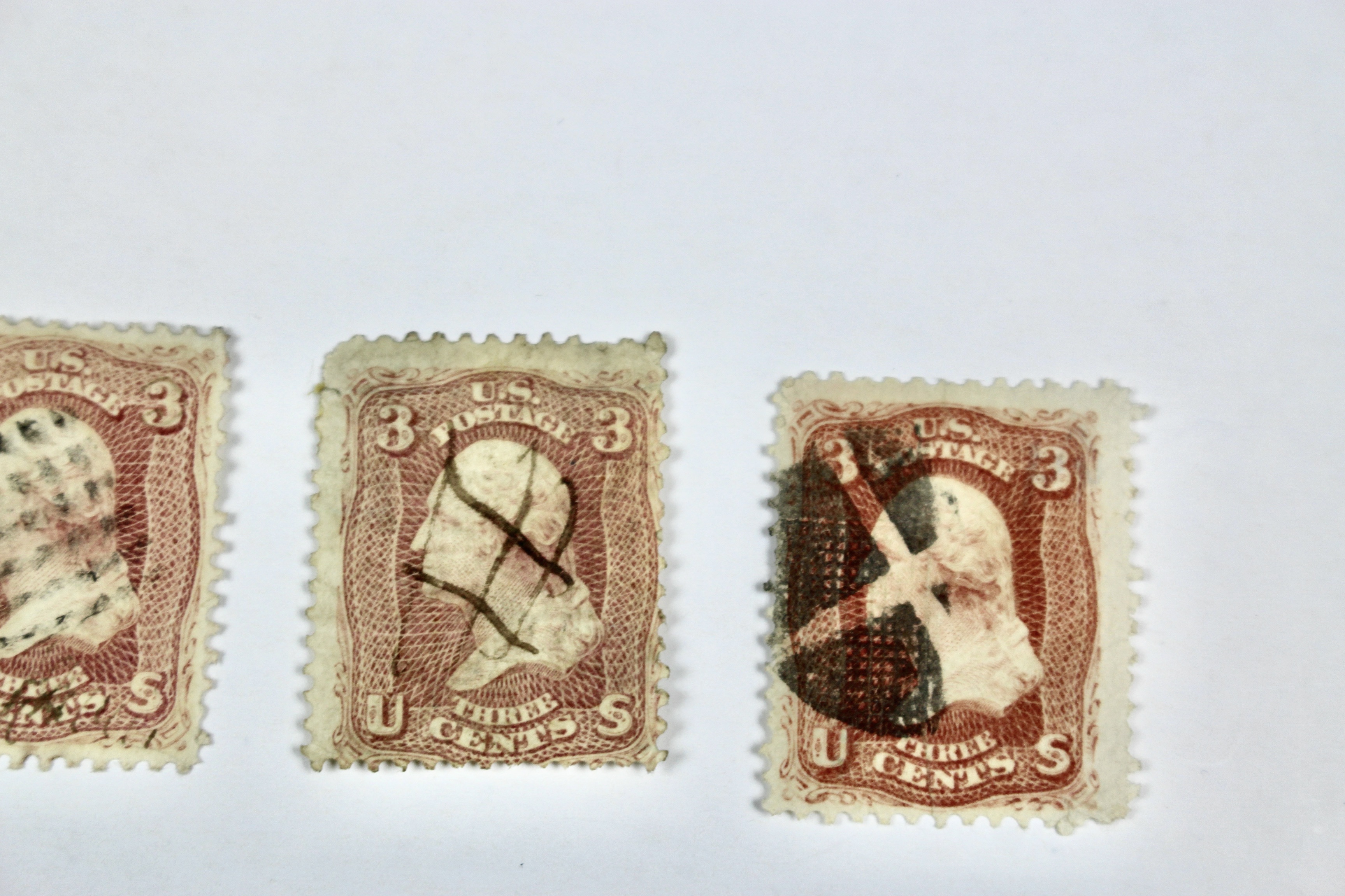 Twenty-Five Early U.S. Postage Stamps, Many with Grills