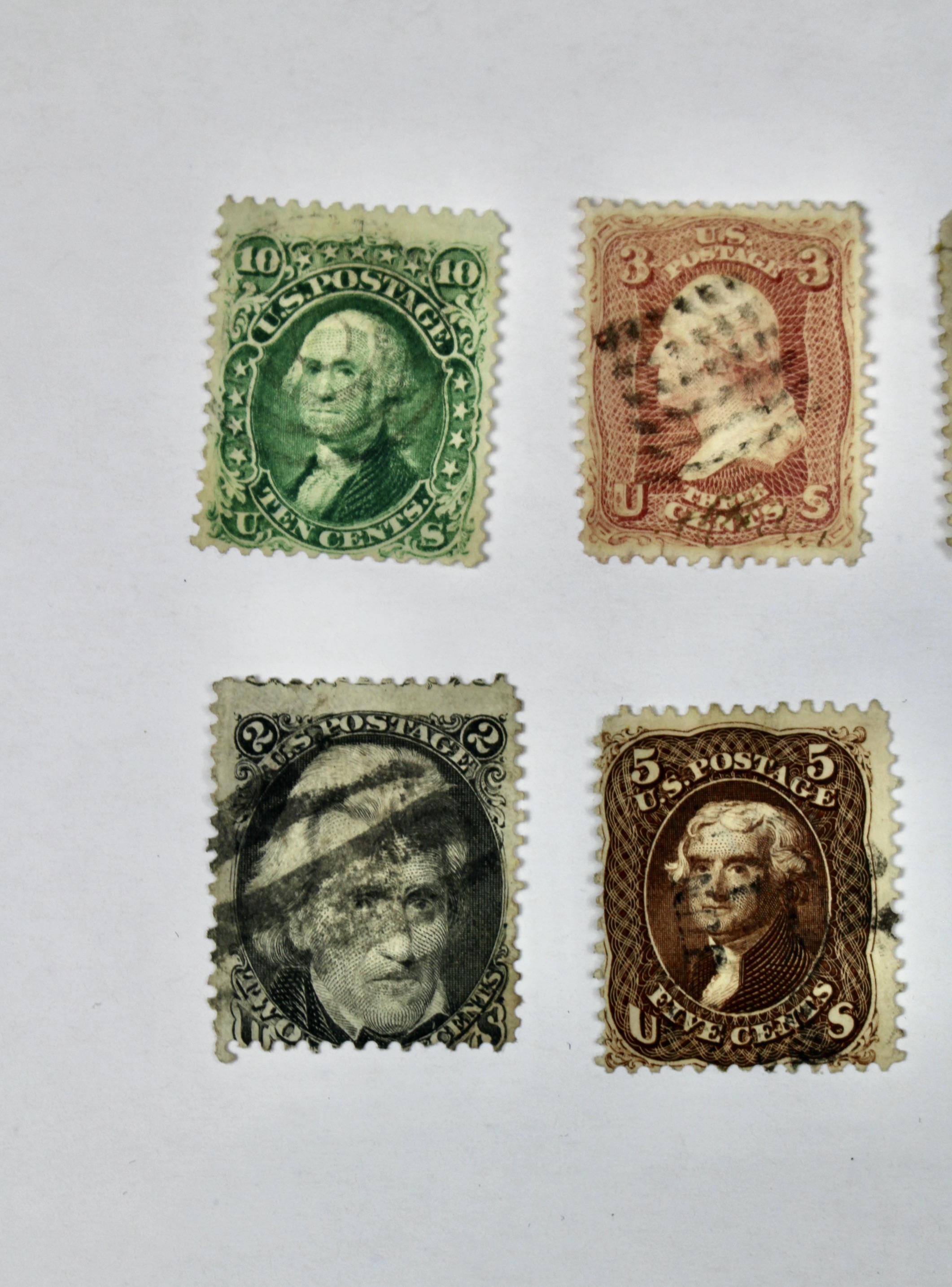 Twenty-Five Early U.S. Postage Stamps, Many with Grills