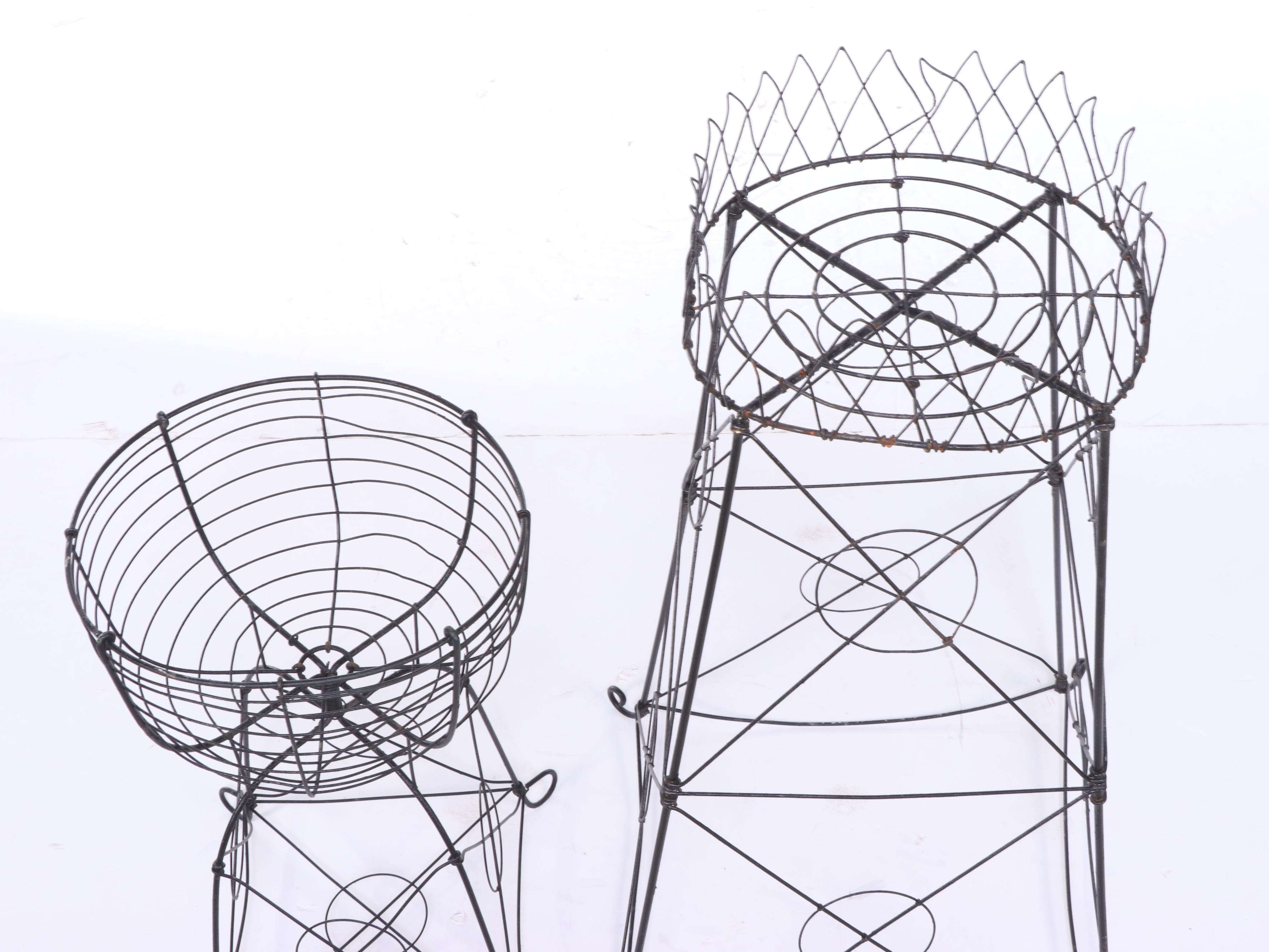 Two Late Victorian Black-Painted Wirework Plant Stands
