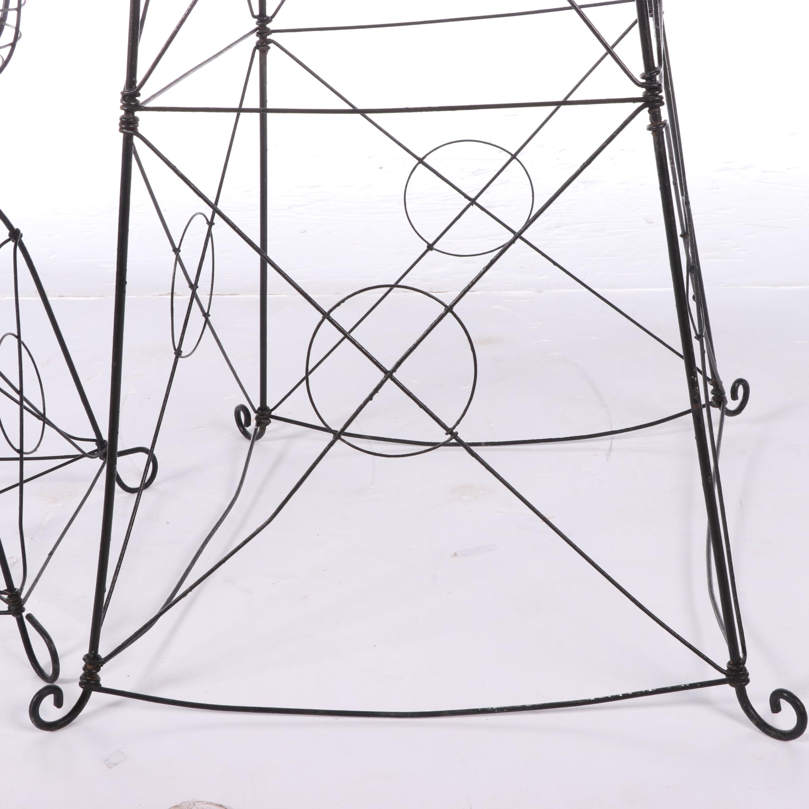 Two Late Victorian Black-Painted Wirework Plant Stands