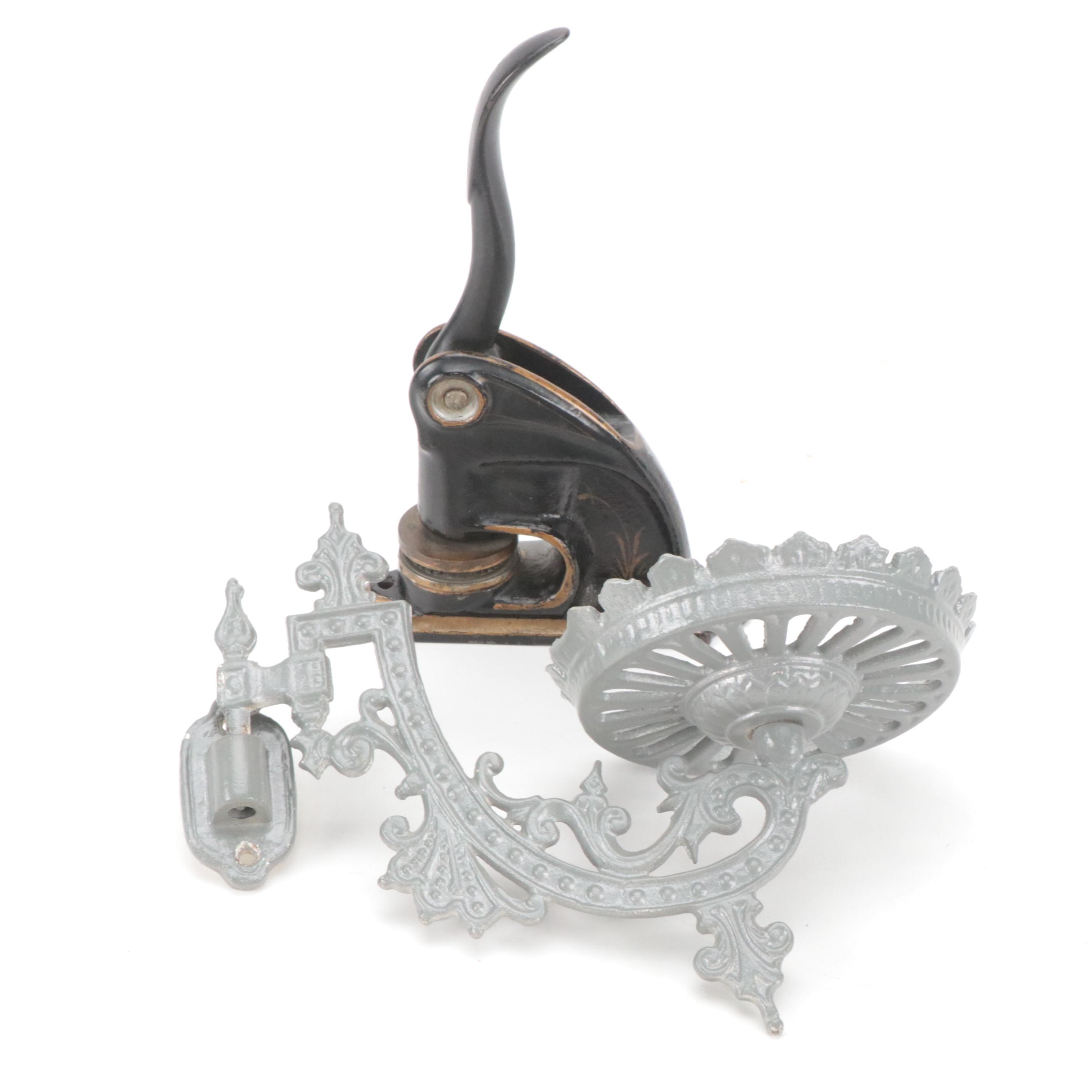 Cast Iron Embossing Seal and Victorian Cast Iron Wall-Mount Oil Lamp Holder