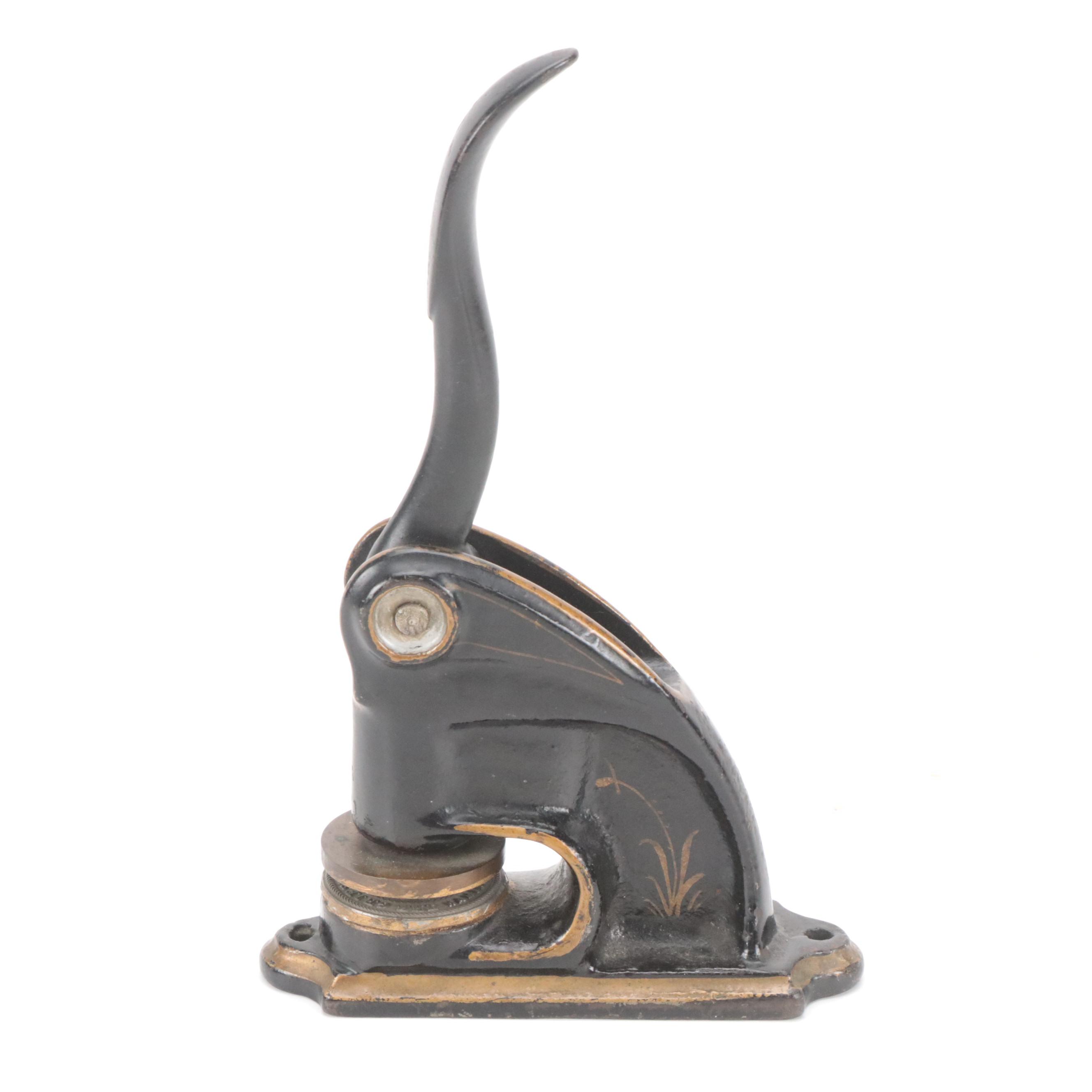 Cast Iron Embossing Seal and Victorian Cast Iron Wall-Mount Oil Lamp Holder