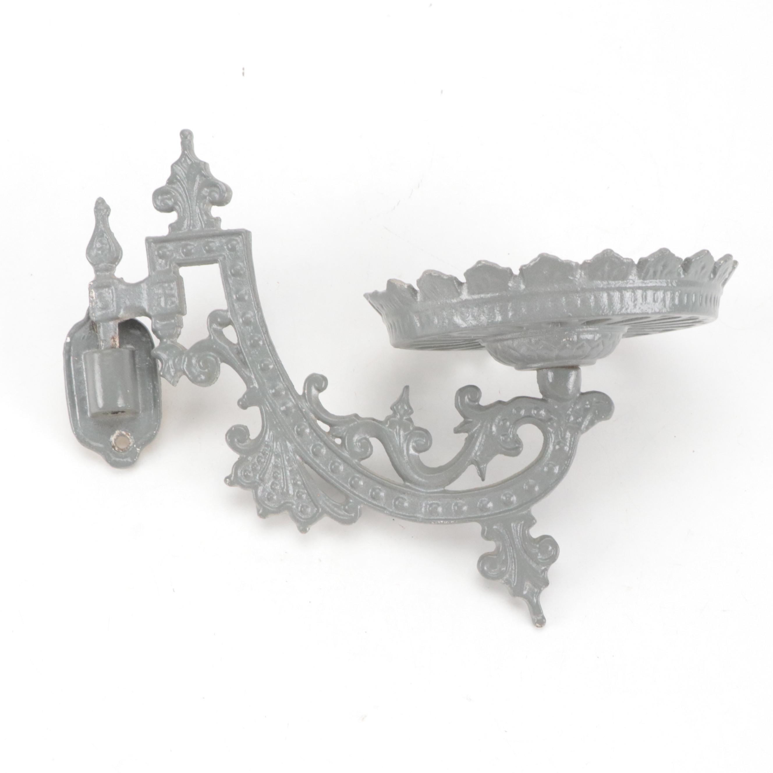 Cast Iron Embossing Seal and Victorian Cast Iron Wall-Mount Oil Lamp Holder