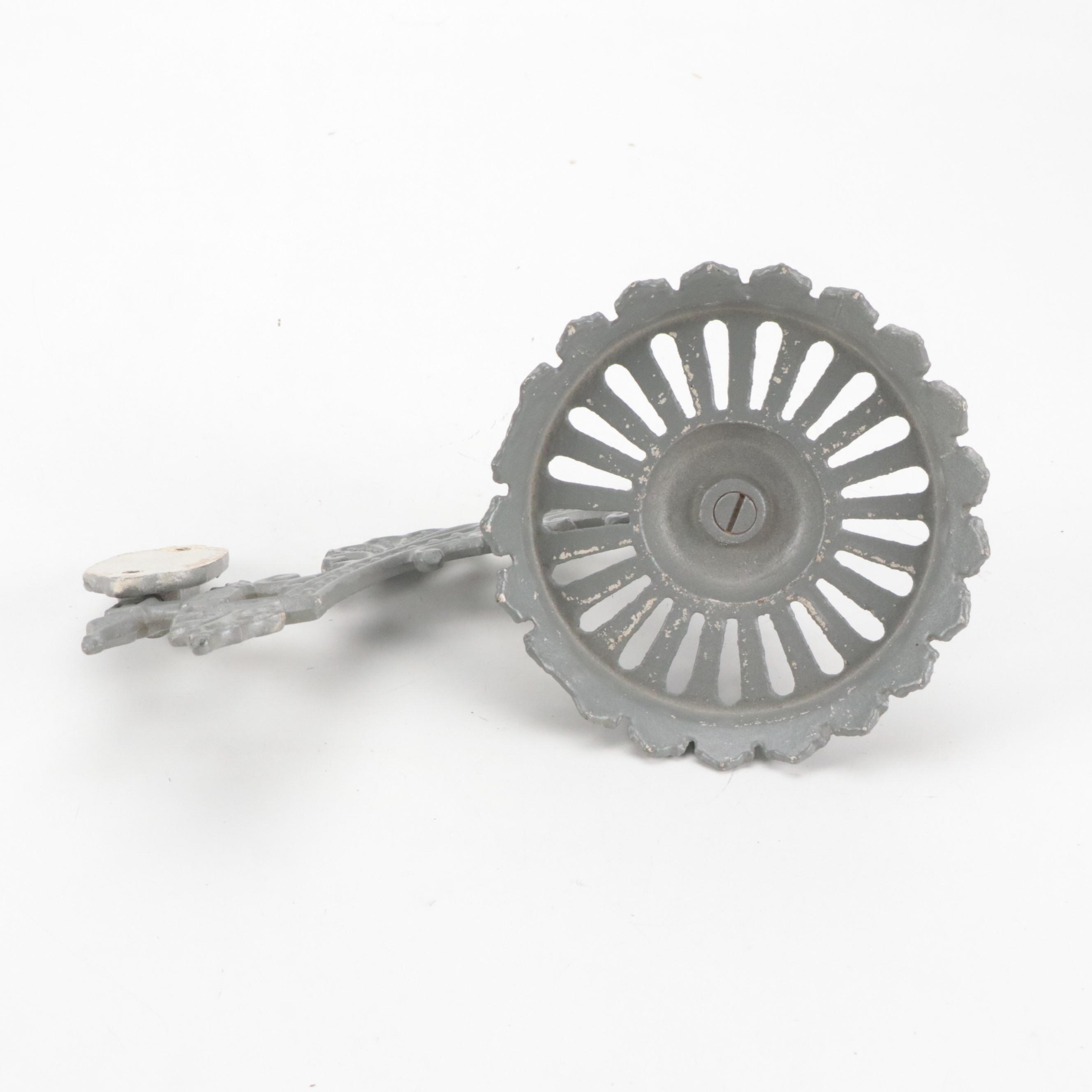 Cast Iron Embossing Seal and Victorian Cast Iron Wall-Mount Oil Lamp Holder