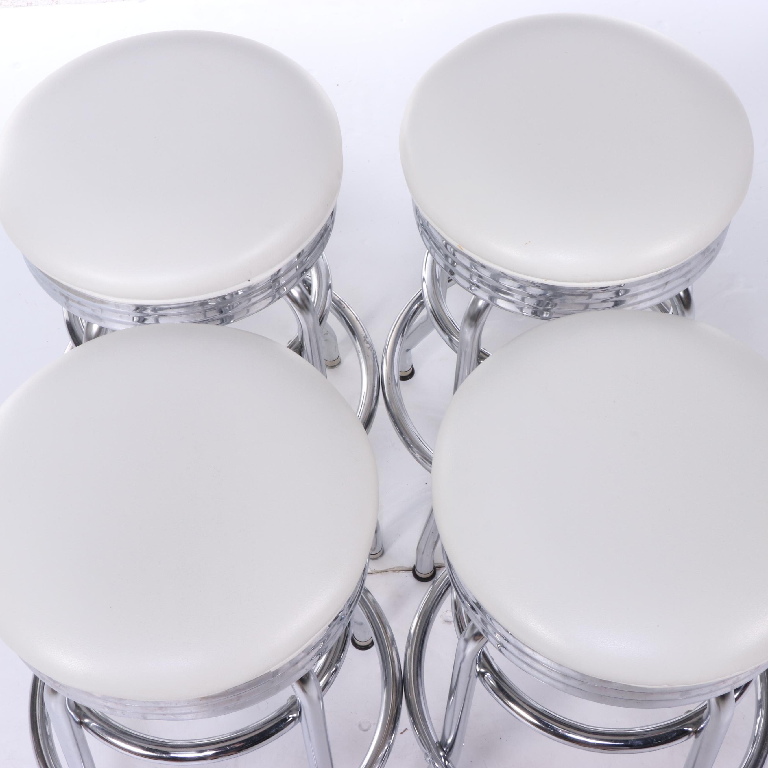 Four Regal Mfg. Co. Modernist Style Chrome and Vinyl Swivel Counter Stools