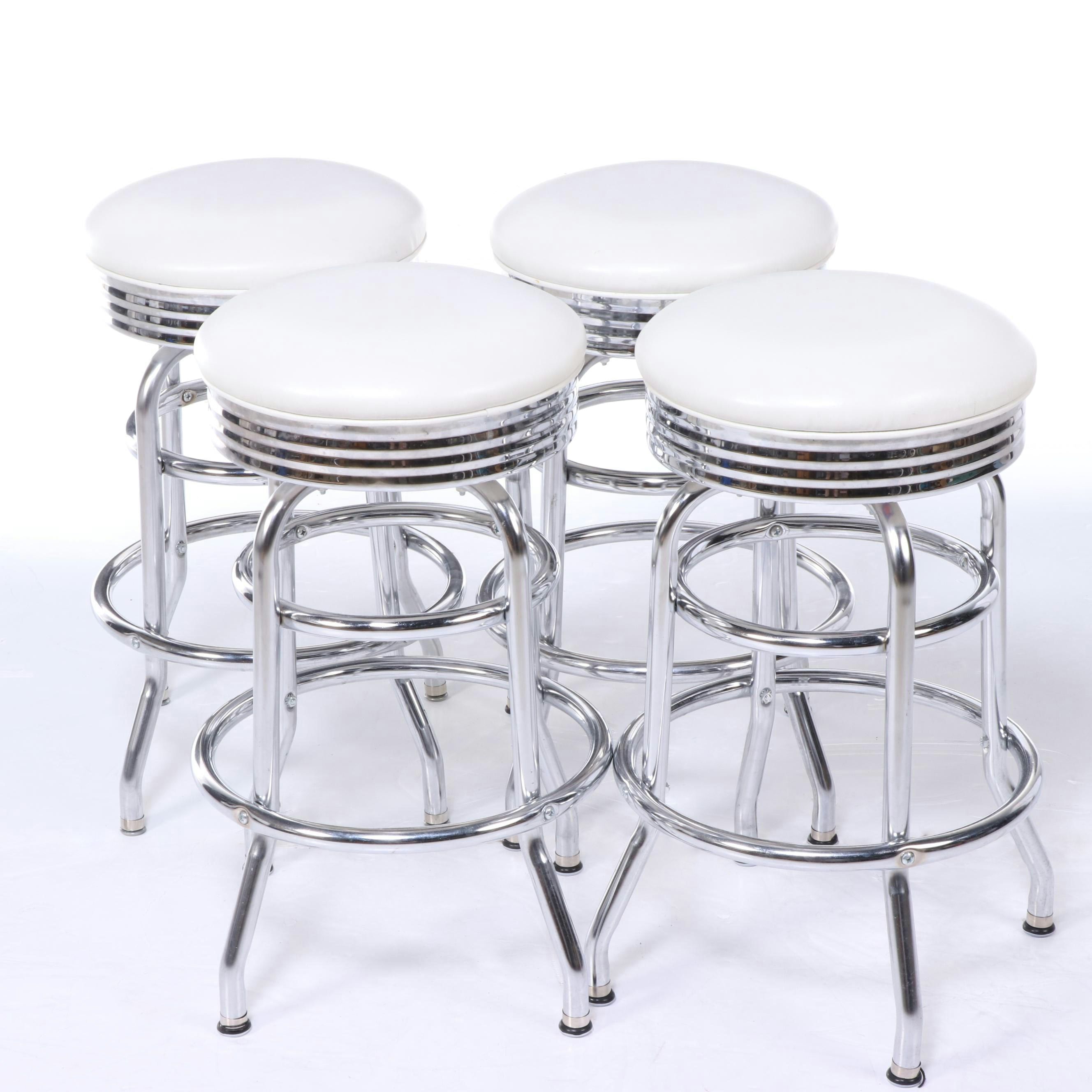 Four Regal Mfg. Co. Modernist Style Chrome and Vinyl Swivel Counter Stools